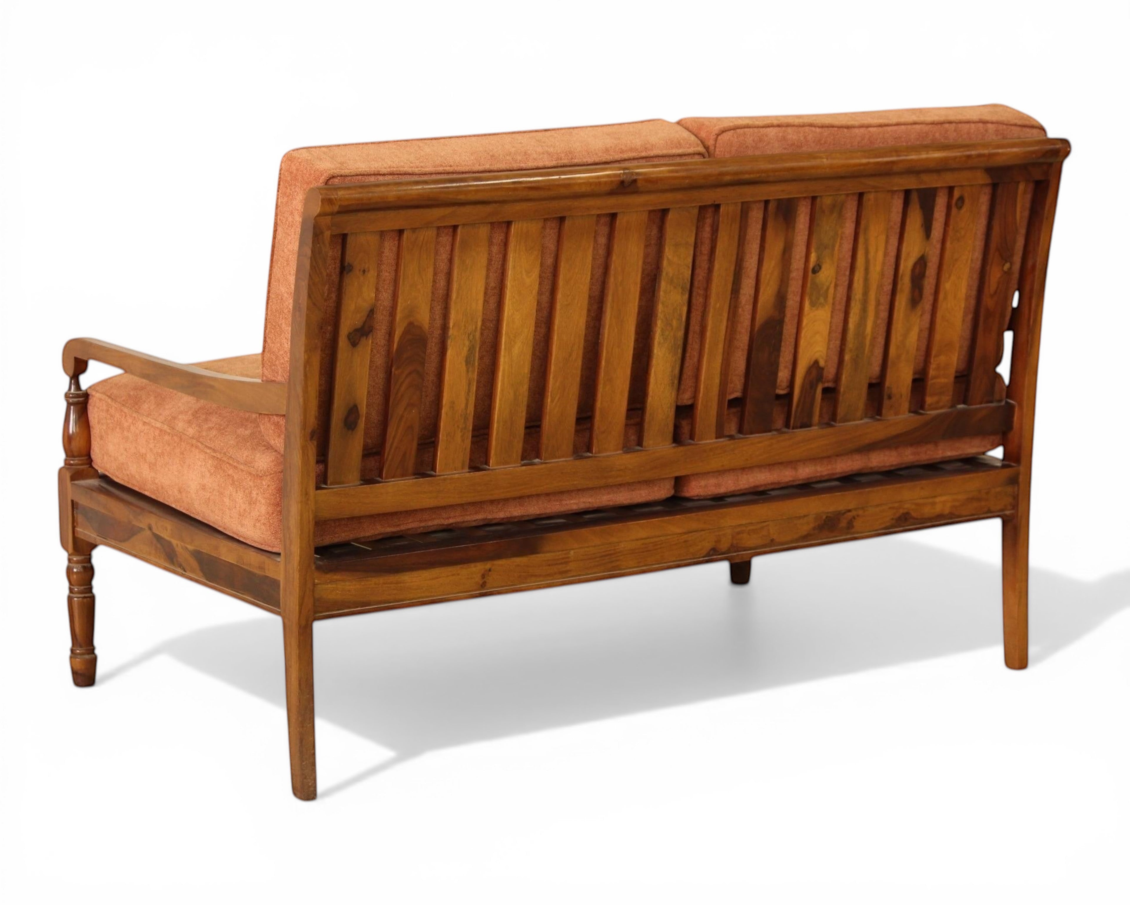 Nakoda Homes 3-piece living room sofa set with rust-colored upholstered seats and wooden frame. Features slatted backrest and armrests.