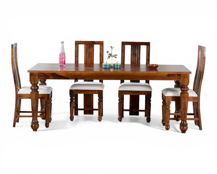 Nakoda Homes Sheesham wood dining set with upholstered white seats and carved legs. Includes table and four chairs.