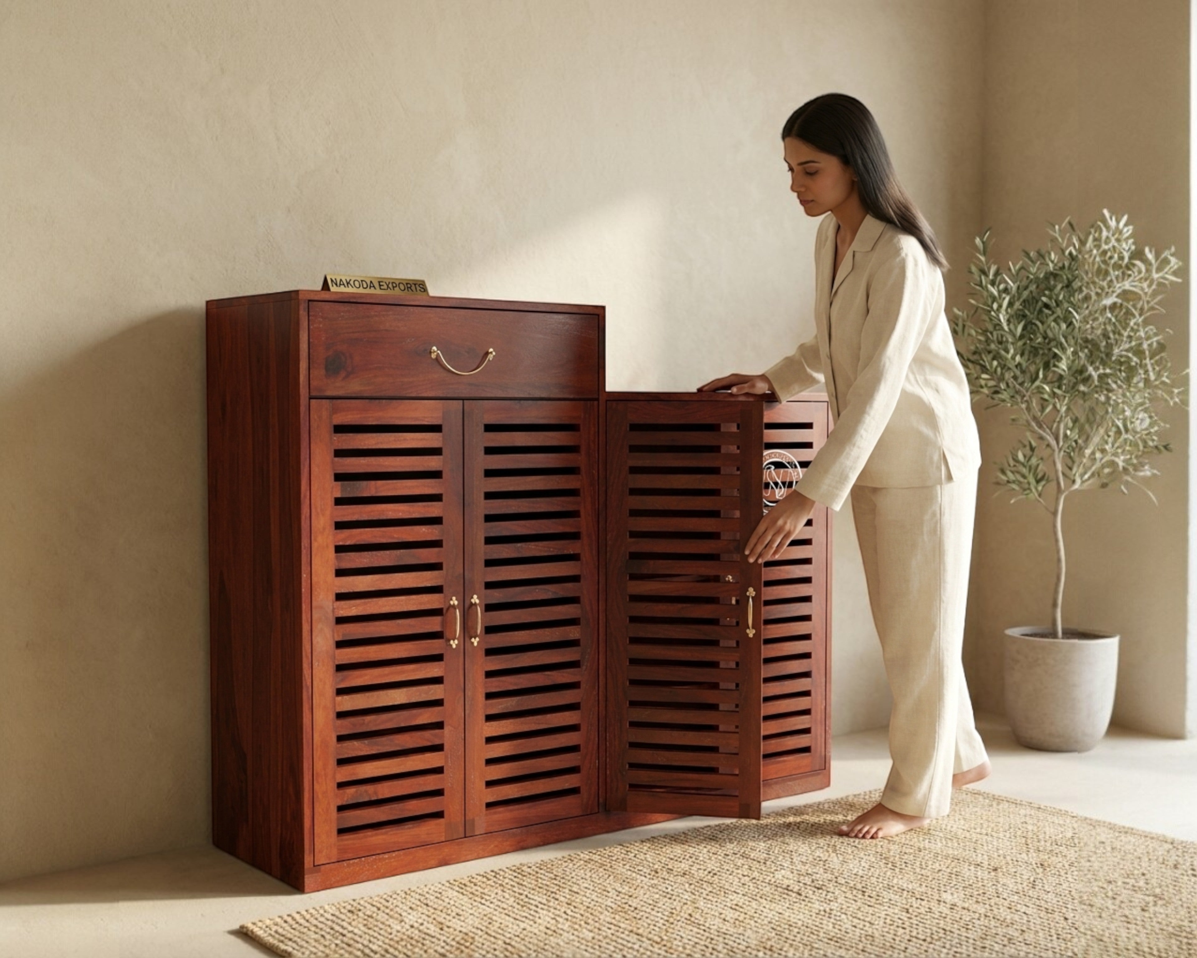 Nakoda Homes Sheesham wood entryway shoe storage cabinet with slatted doors and a drawer.