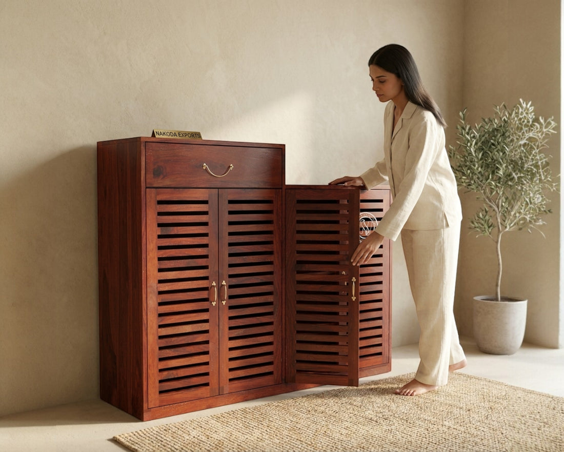 Nakoda Homes Sheesham wood entryway shoe storage cabinet with slatted doors and a drawer.
