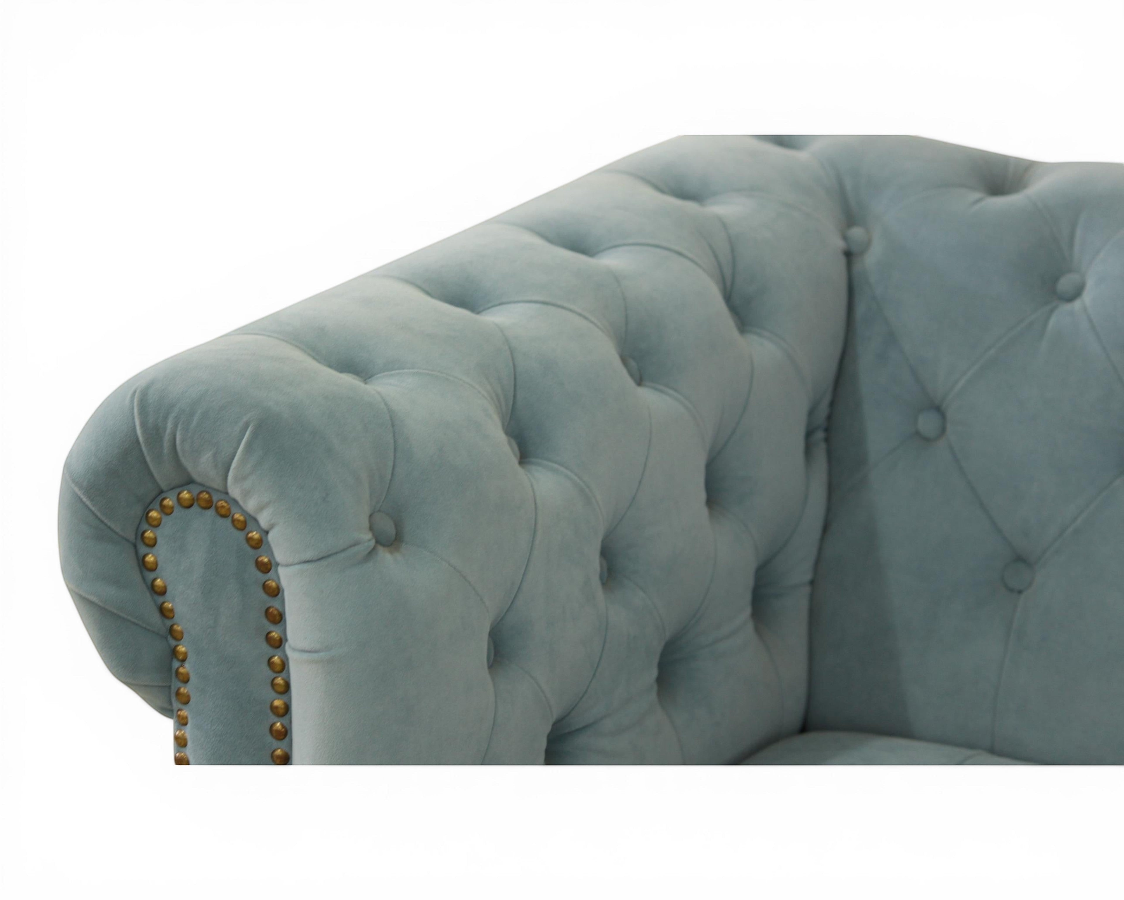 Nakoda Homes sky blue velvet Chesterfield sofa with deep button-tufting and nailhead trim.
