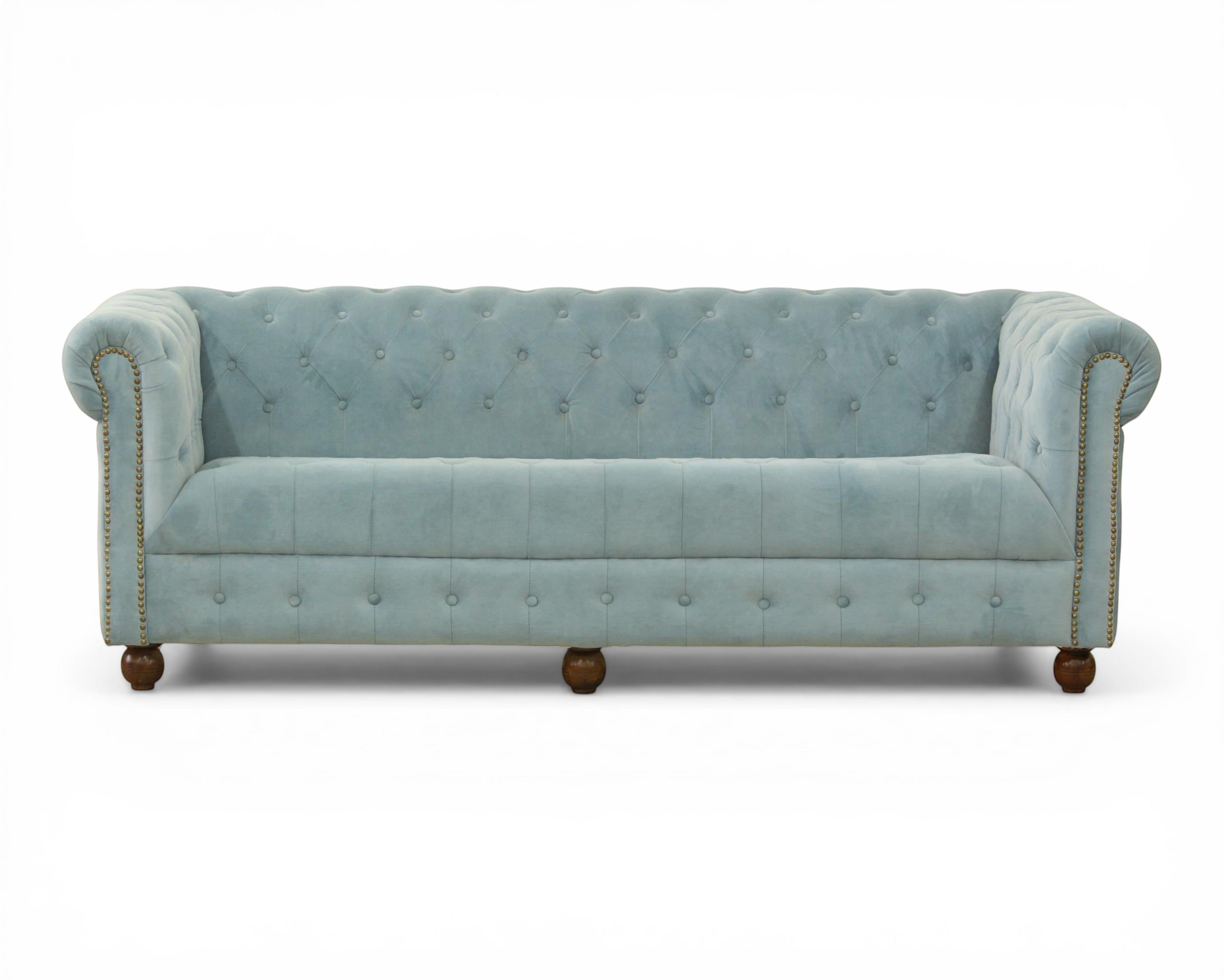 Nakoda Homes sky blue velvet Chesterfield sofa with deep button-tufting, rolled arms, and nailhead trim.
