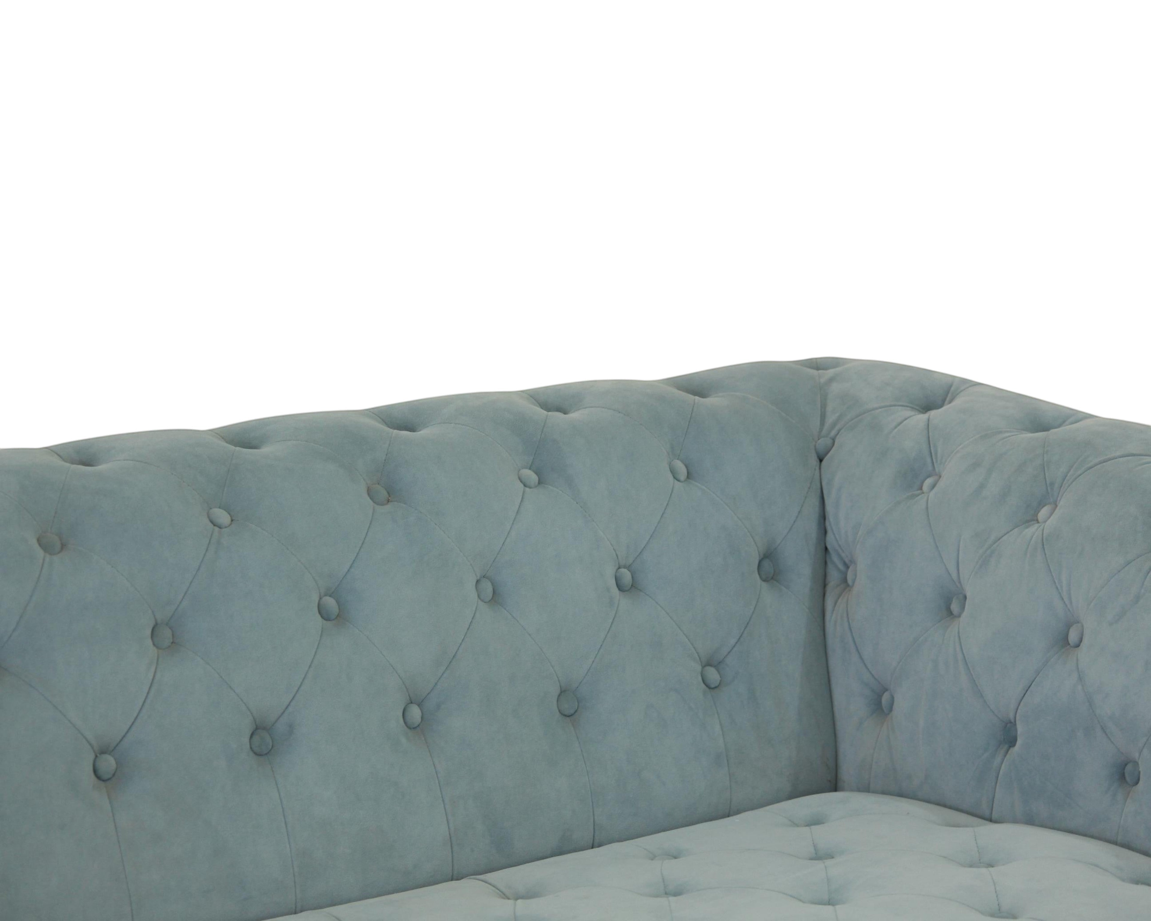 Nakoda Homes sky blue velvet Chesterfield sofa with deep button-tufting and rolled arms.