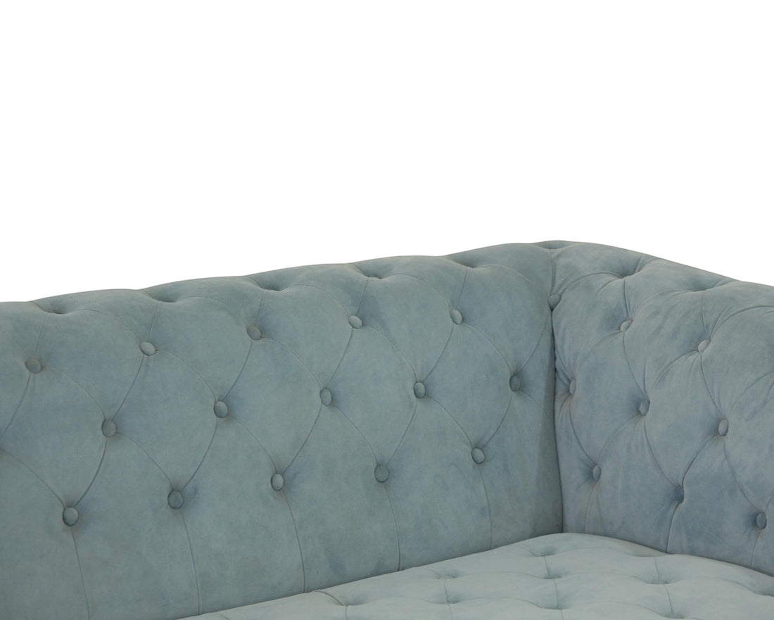 Nakoda Homes sky blue velvet Chesterfield sofa with deep button-tufting and rolled arms.