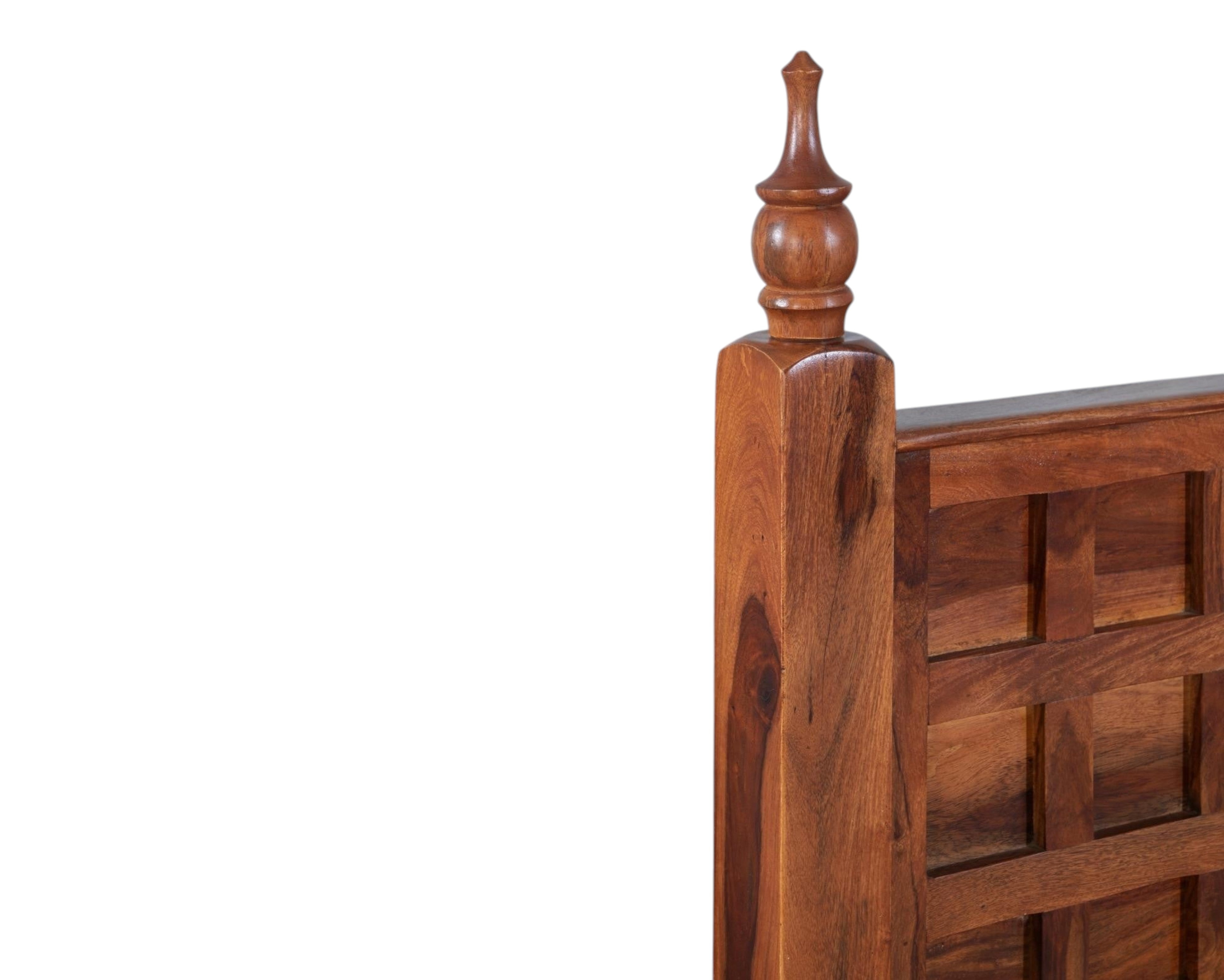 Nakoda Homes solid wood bed frame with lattice headboard and turned posts in warm wood tone.