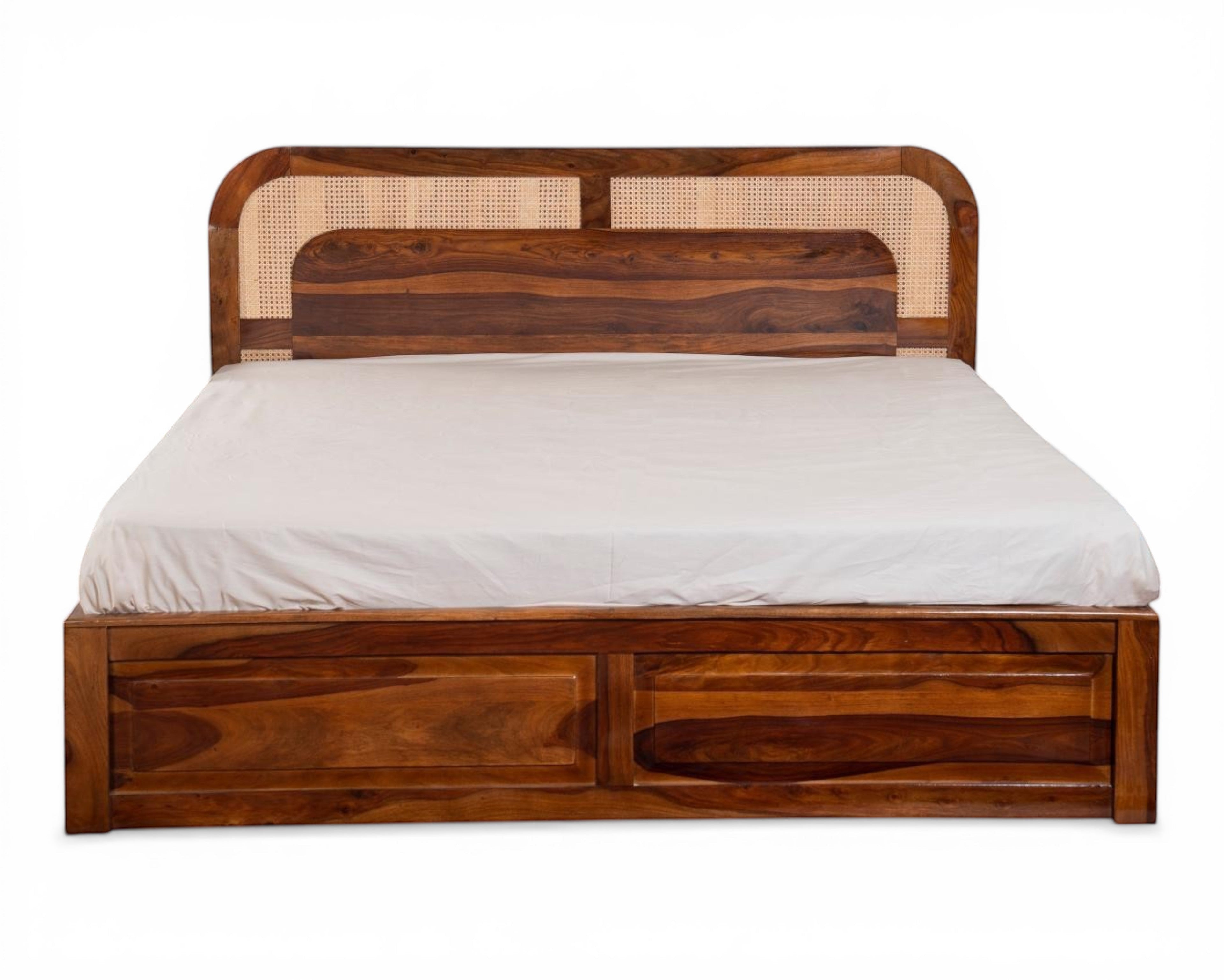 Nakoda Homes solid wood platform bed with cane headboard and storage drawers. Warm wood finish with natural cane detailing.