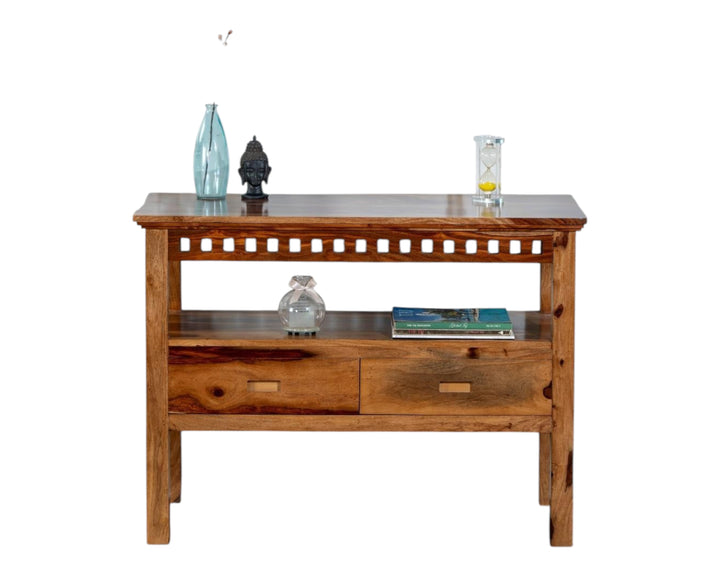 Nakoda Homes solid wood console table with two drawers and open shelf, featuring carved detailing.