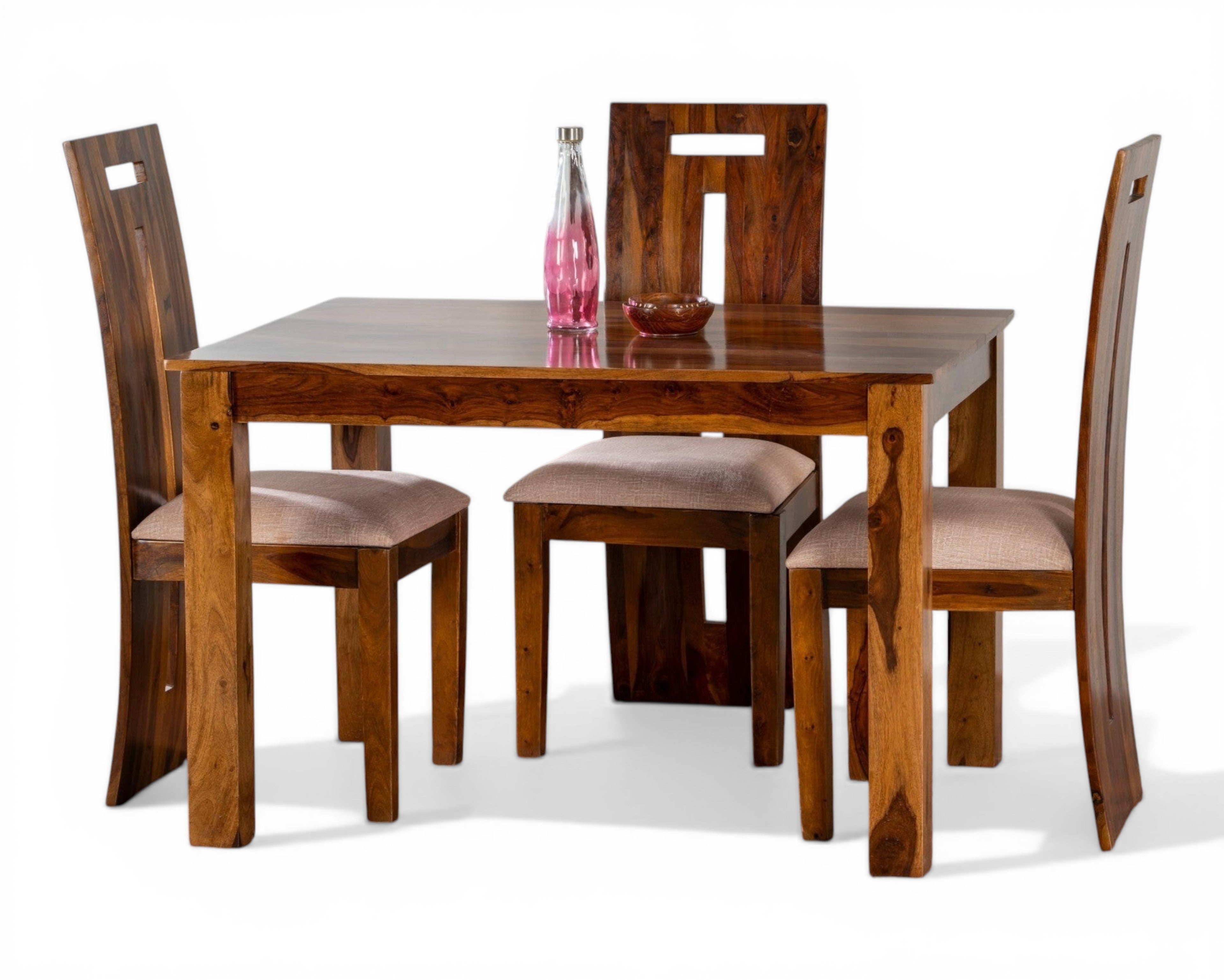 Nakoda Homes solid wood dining set with four chairs featuring upholstered seats and a minimalist design with natural wood grain.