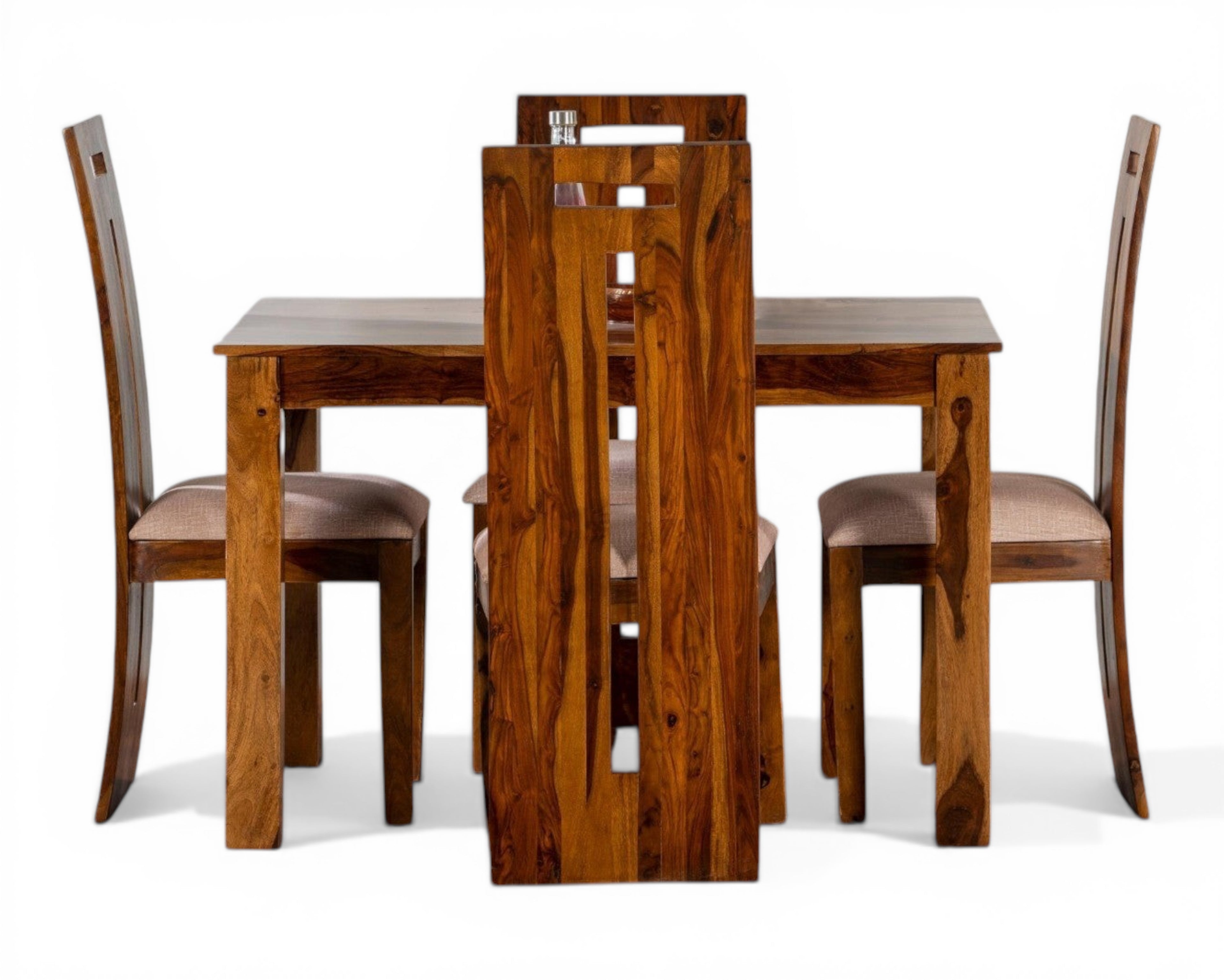 Nakoda Homes solid wood dining set with four chairs and a table, featuring natural wood grain and minimalist design.