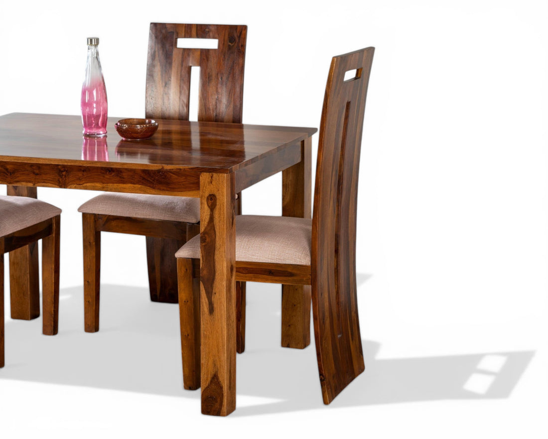 Nakoda Homes solid wood dining set with four chairs, featuring natural wood grain and minimalist design.
