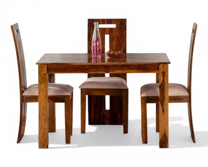 Nakoda Homes solid wood dining set with four chairs and a table, featuring natural wood grain and upholstered seats.
