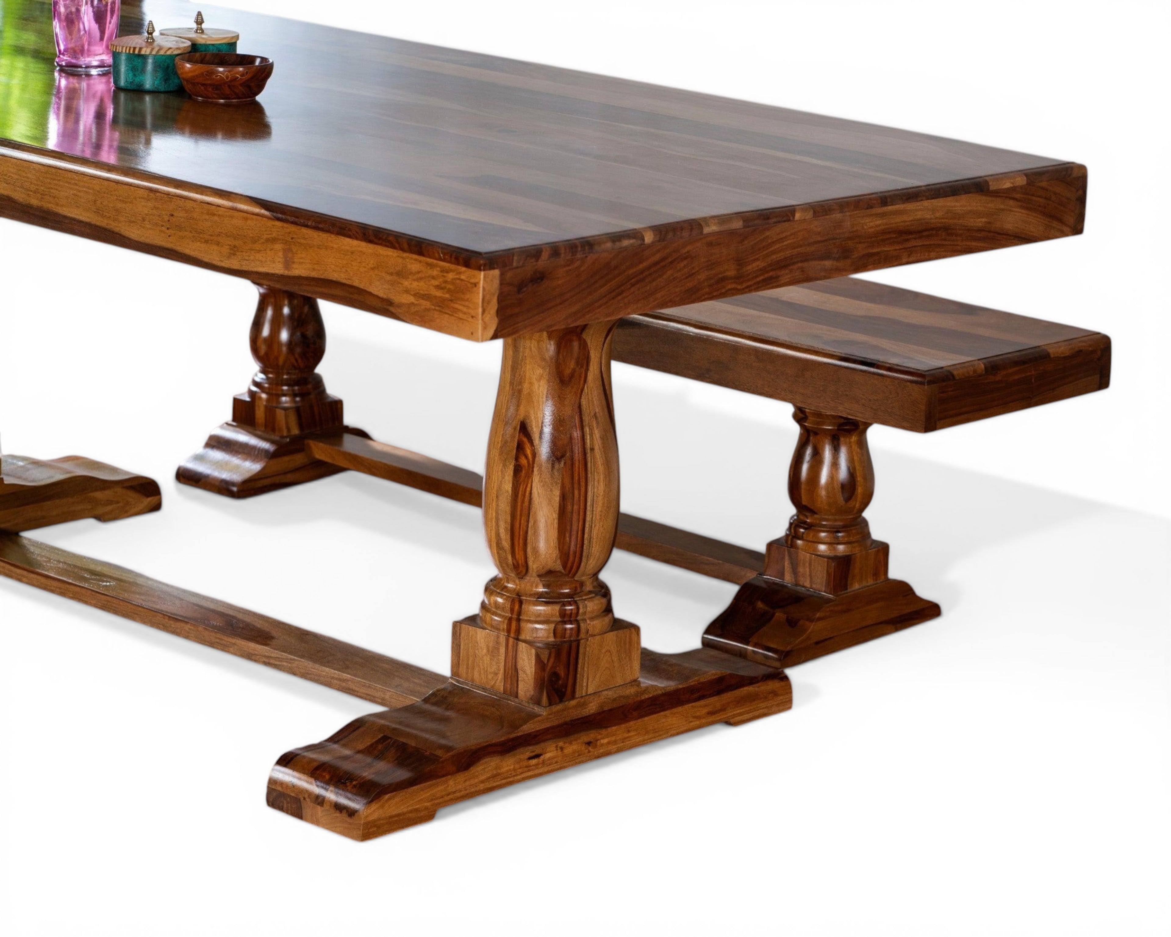 Nakoda Homes solid wood dining table and benches with pedestal legs in warm brown tones. Rustic yet refined design.