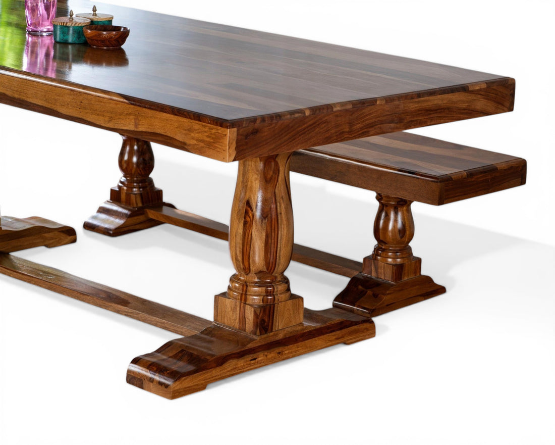 Nakoda Homes solid wood dining table and benches with pedestal legs in warm brown tones. Rustic yet refined design.