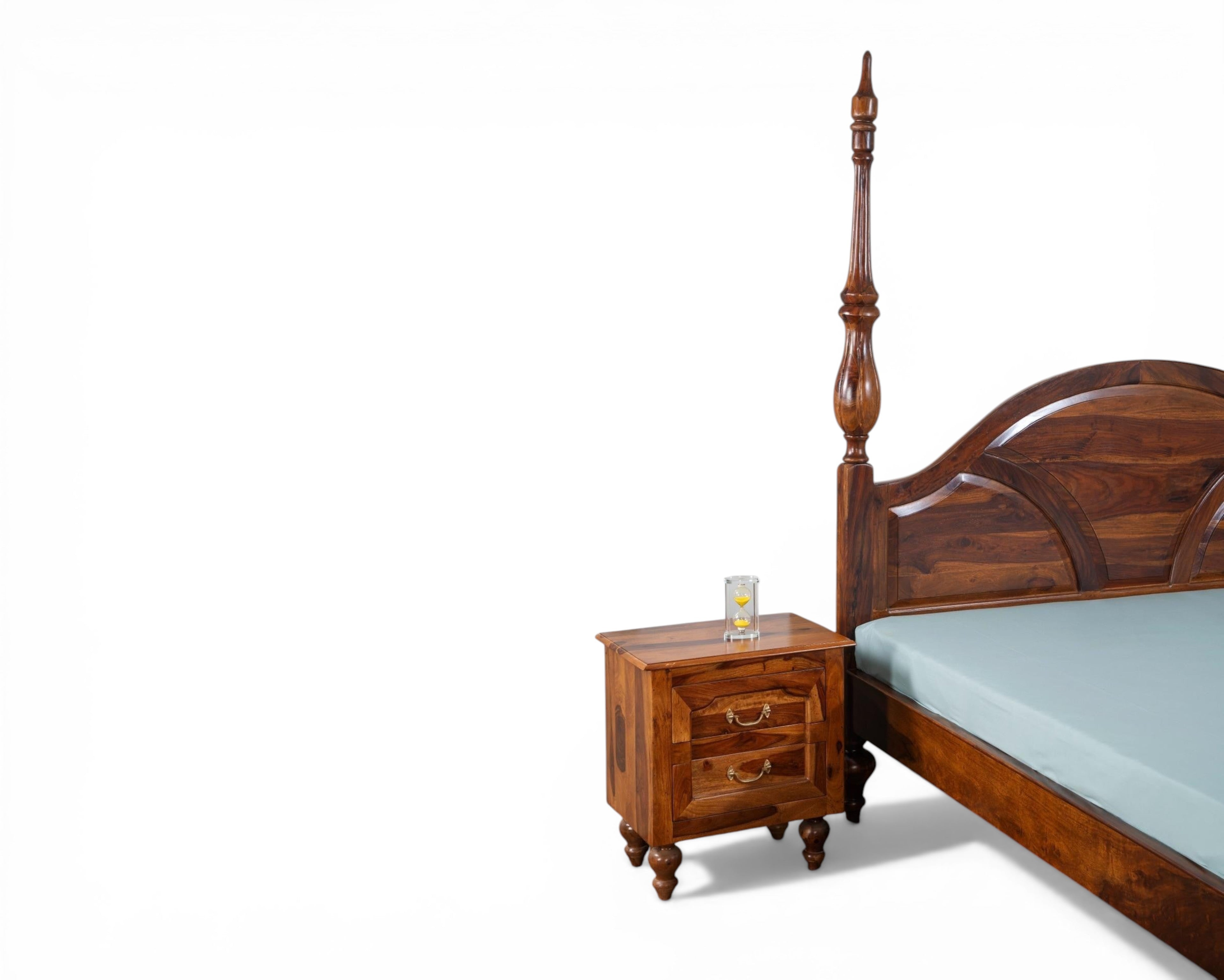 Nakoda Homes solid wood four poster canopy bed with arched headboard and ornate detailing. Warm wood tone.