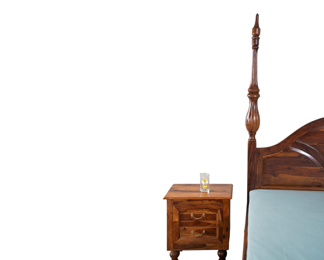 Nakoda Homes solid wood four poster canopy bed with arched headboard and intricate detailing. Warm wood tone.