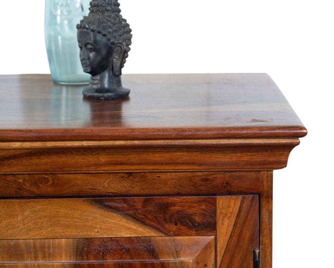 Nakoda Homes solid Sheesham wood media console with cabinet storage and open shelf. Rich wood grain and warm tones.