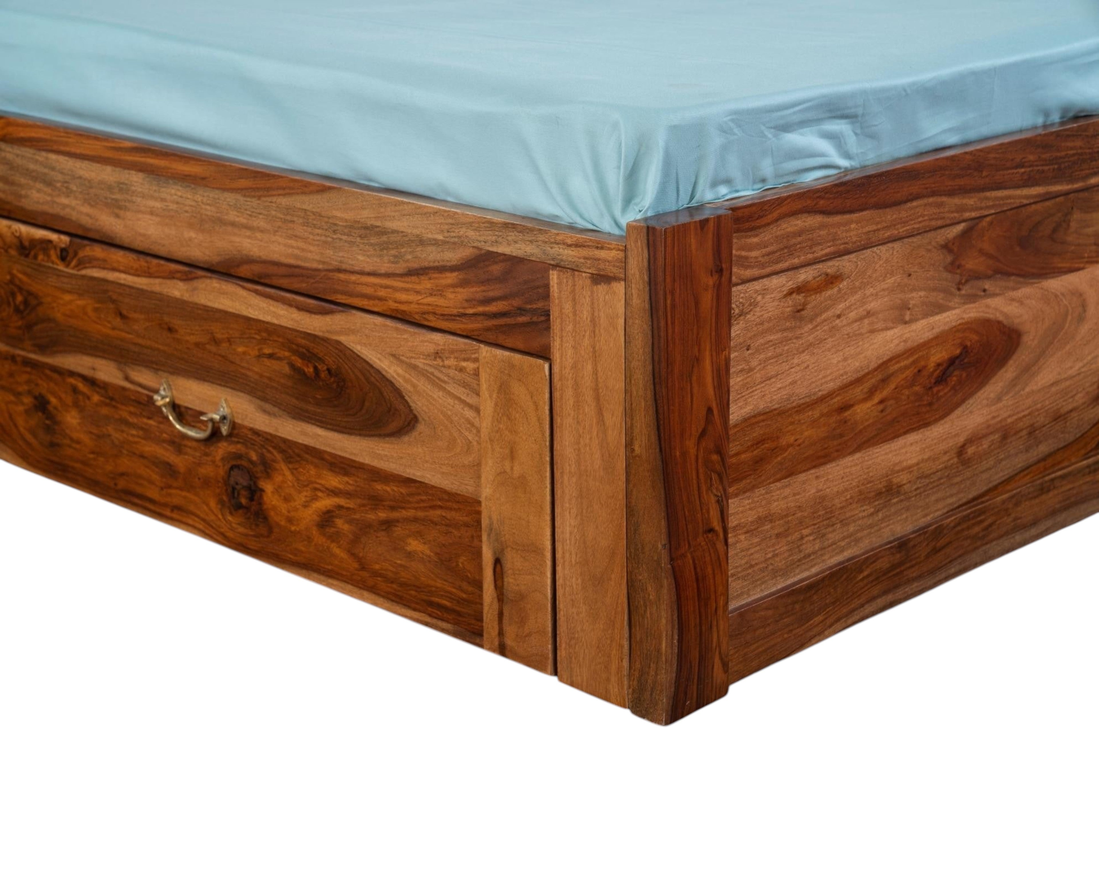 Nakoda Homes solid wood platform bed with storage drawers and a light blue sheet.