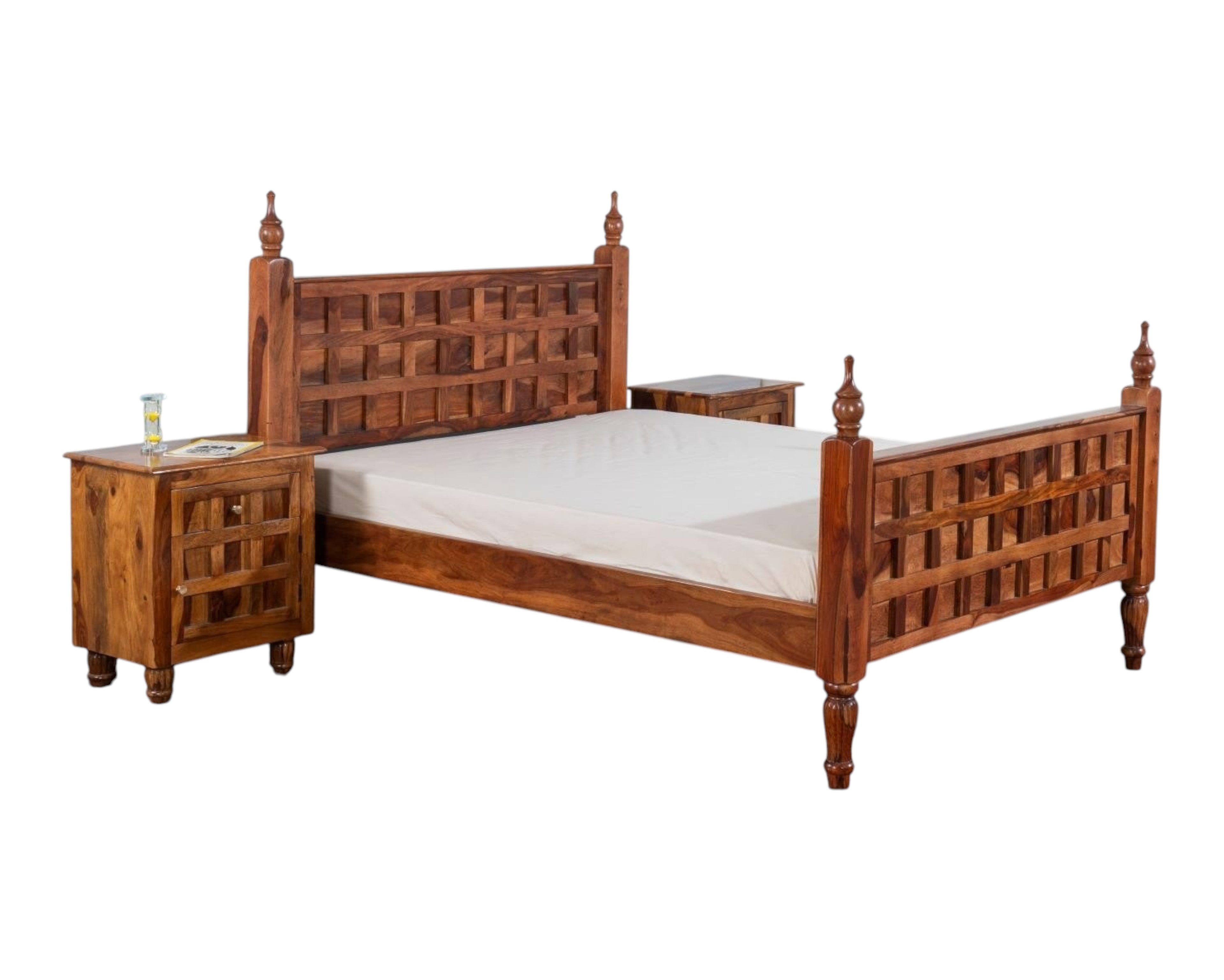 Nakoda Homes solid wood bed frame with lattice headboard, turned posts, and finials. Warm wood tone.
