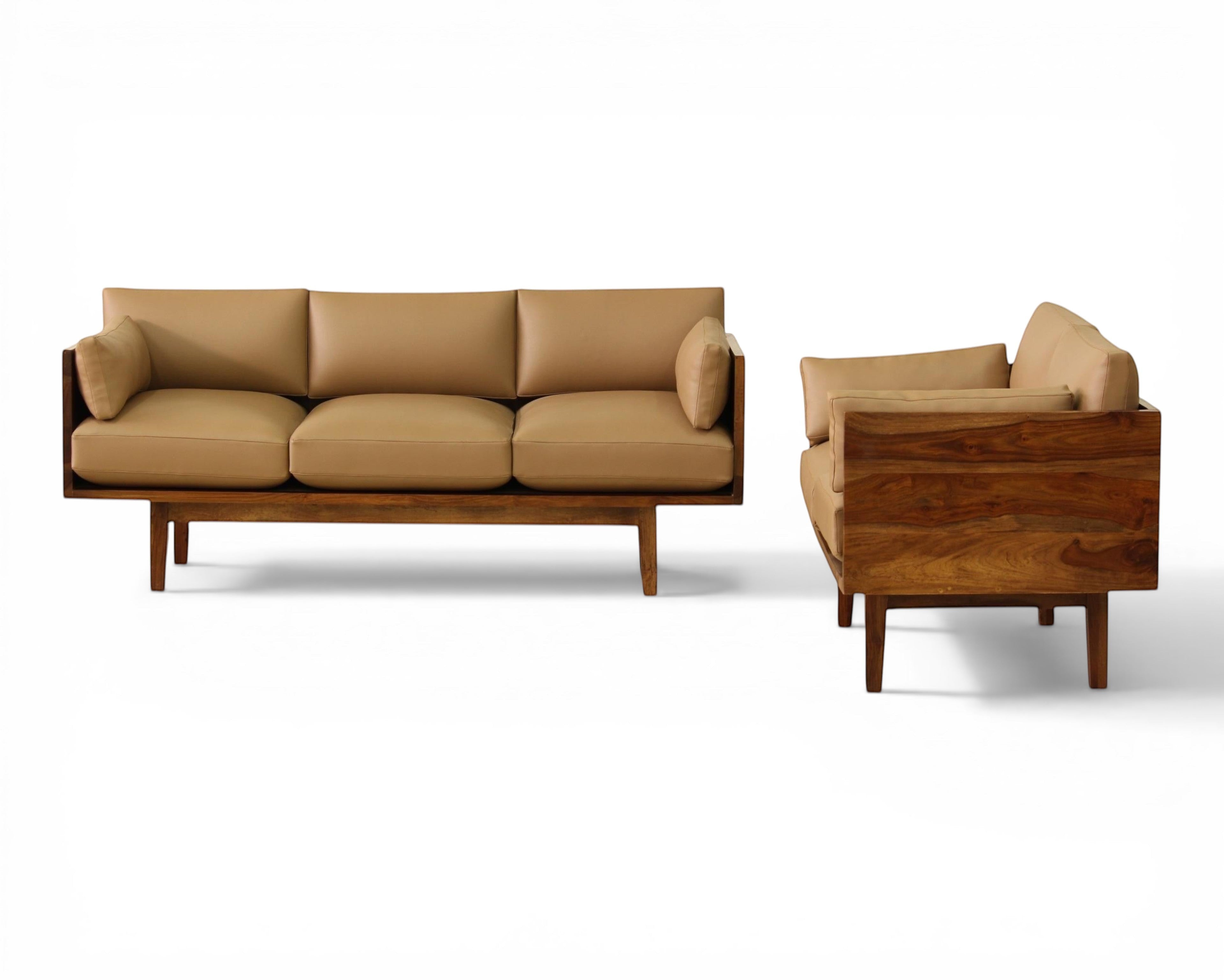 Nakoda Homes modern tan upholstered three-seater sofa with warm wood frame and clean lines.
