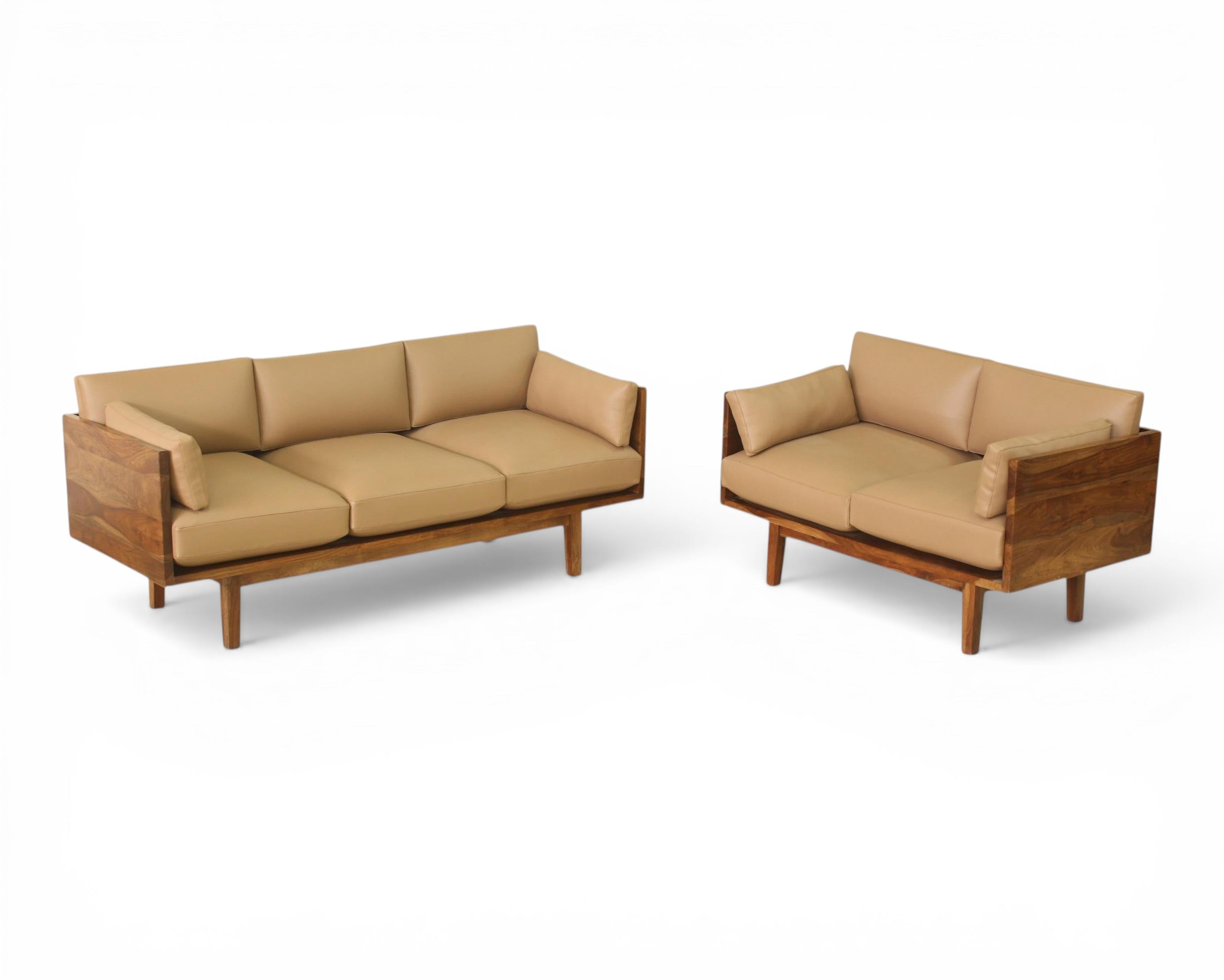 Nakoda Homes modern three-seater sofa with tan upholstery and warm wood frame. Clean lines, minimalist design.
