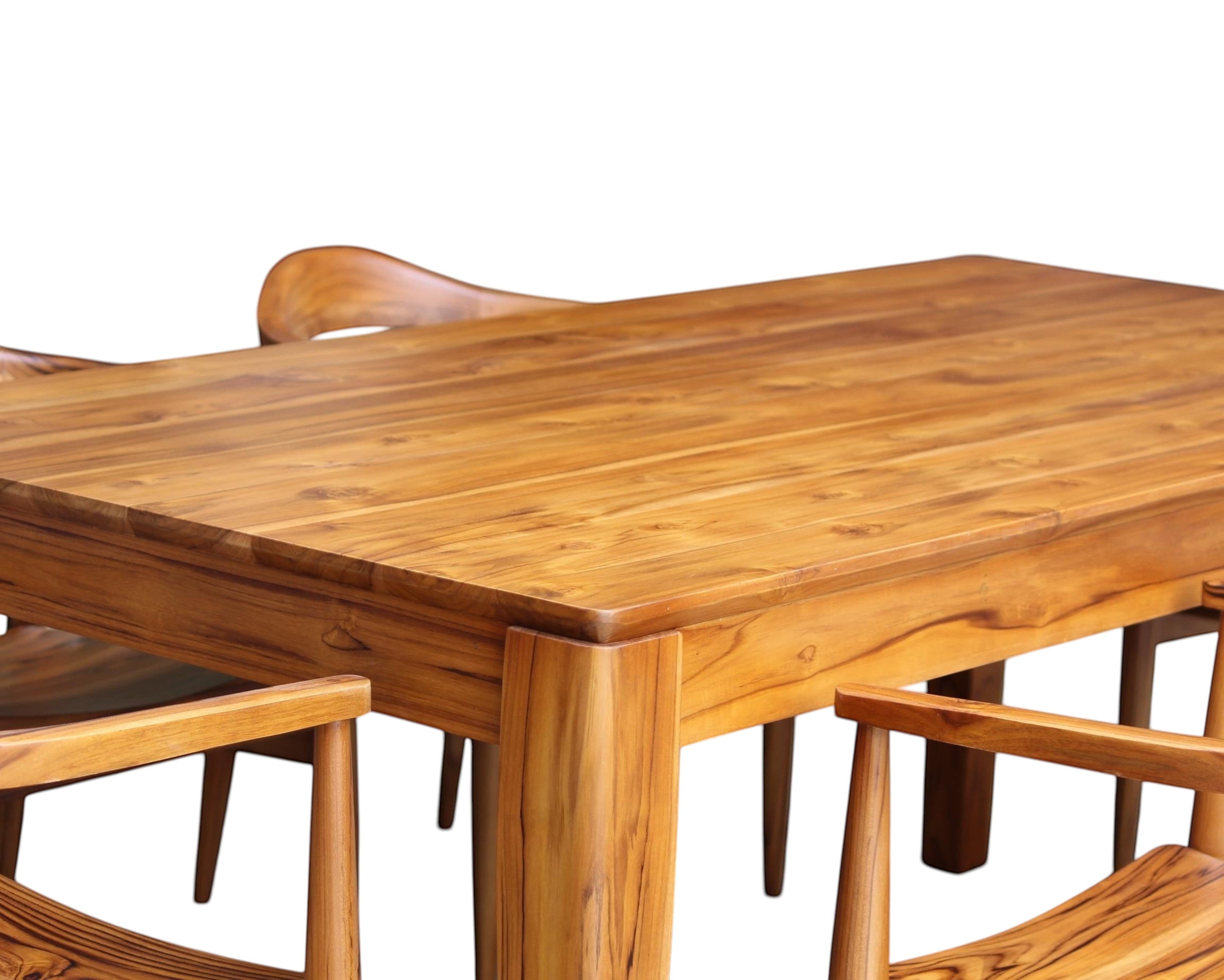 Nakoda Homes solid teak wood dining set with six chairs, natural wood grain, warm finish, timeless design.