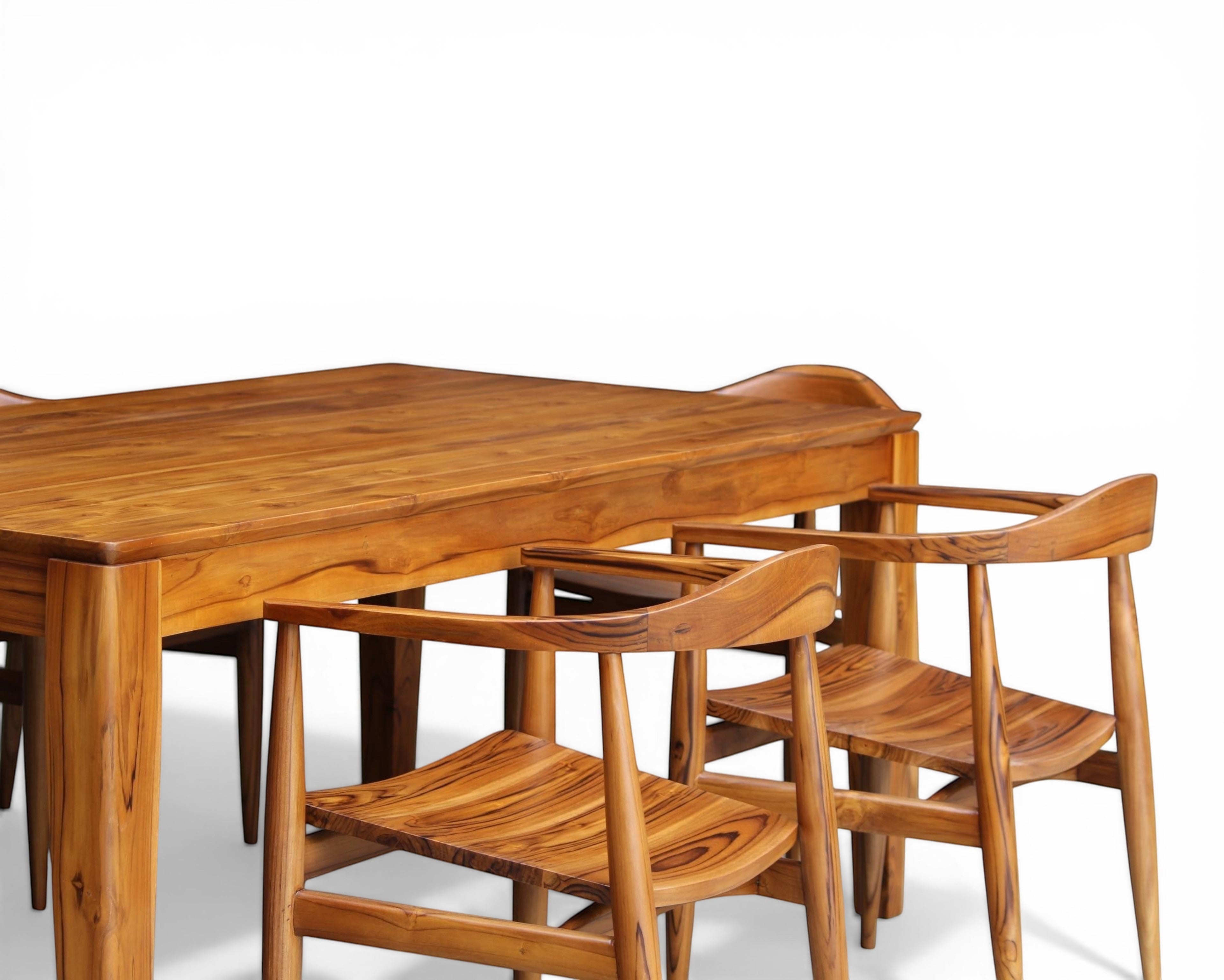 Nakoda Homes solid wood teak dining set with six chairs, featuring a warm finish and natural grain.