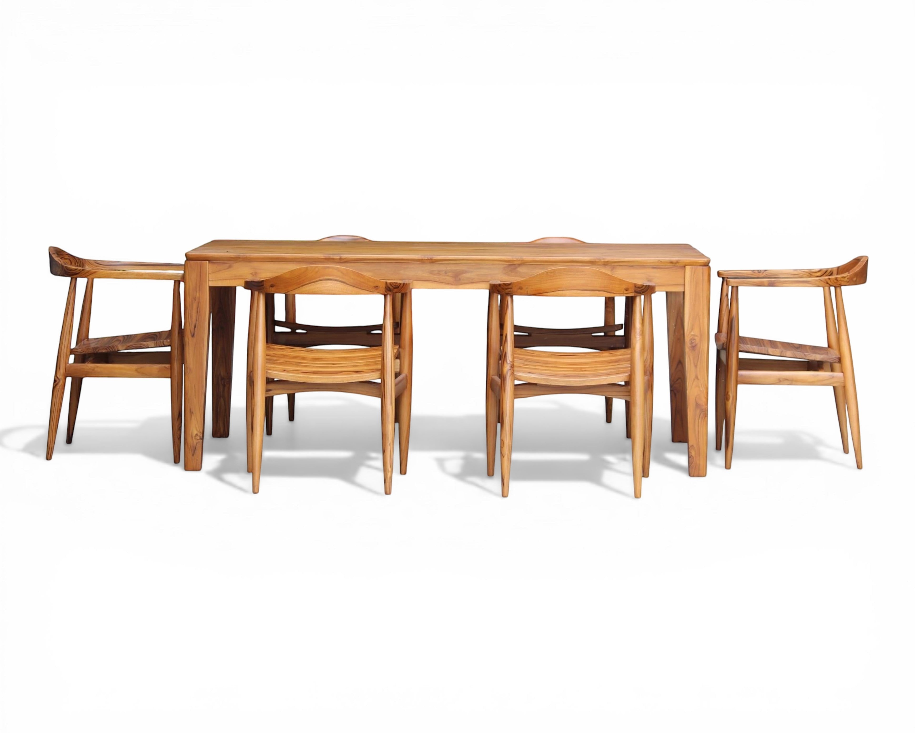 Nakoda Homes solid wood teak dining set with six chairs, featuring a natural wood finish and elegant grain.