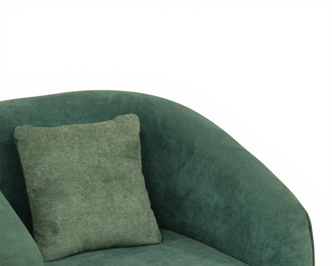 Nakoda Homes teal upholstered sofa set with curved silhouette and matching throw pillow, made of soft-touch fabric.