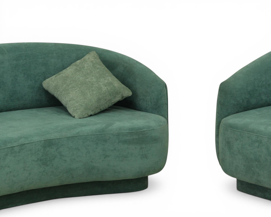 Nakoda Homes teal upholstered curved sofa and armchair set with rounded arms and plush fabric. Includes throw pillows.