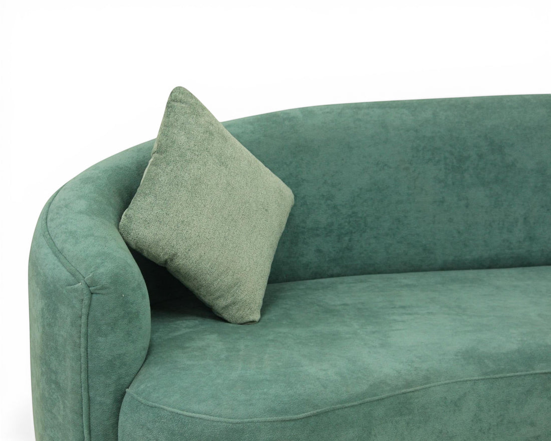 Nakoda Homes teal upholstered sofa set with curved silhouette and rounded arms, plush fabric, includes throw pillow.