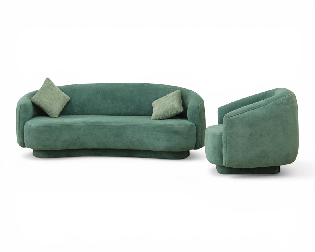 Nakoda Homes teal upholstered curved sofa set with rounded arms and two throw pillows. Plush fabric.