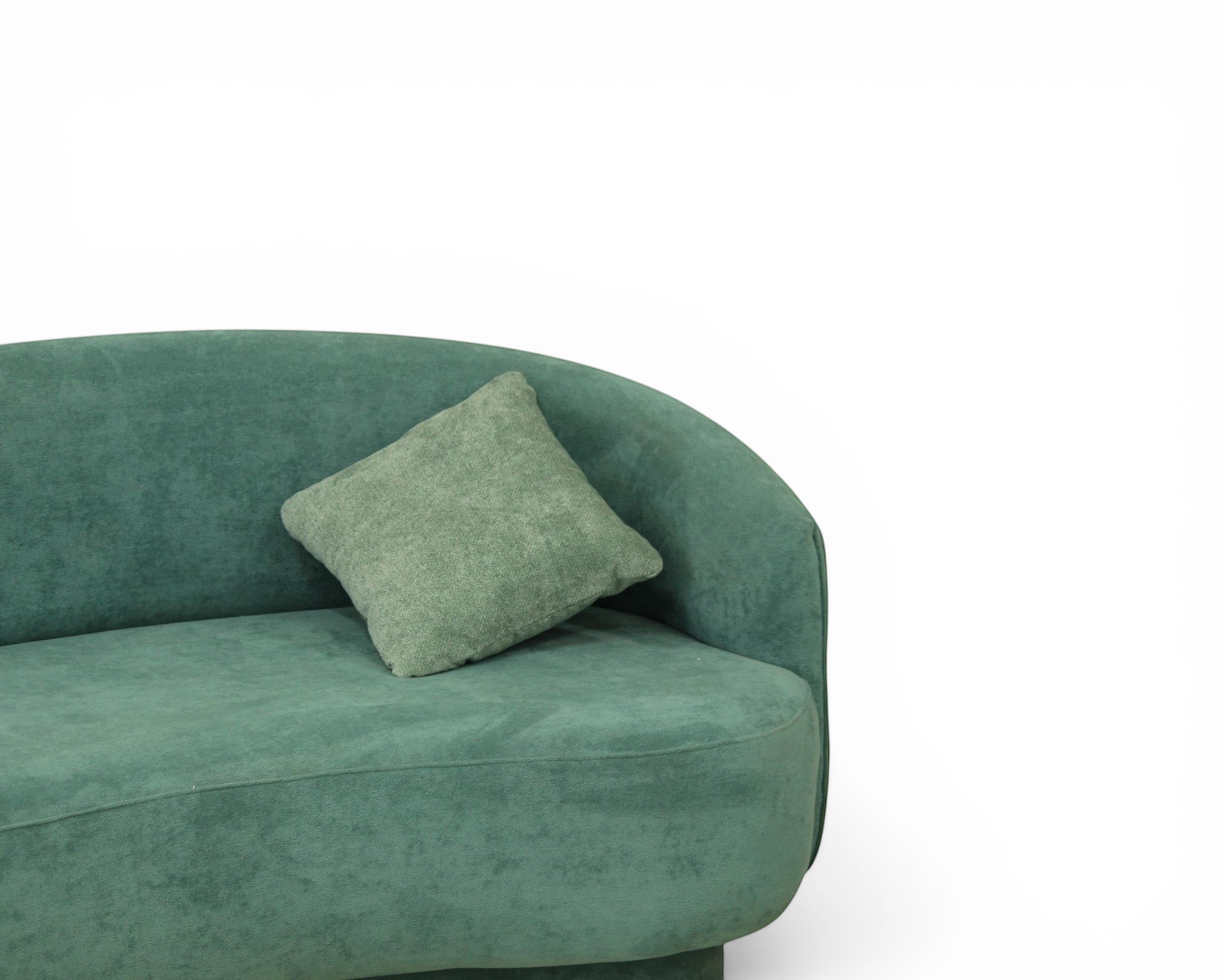 Nakoda Homes teal upholstered curved sofa set with rounded arms and plush fabric, includes armchair and throw pillows.