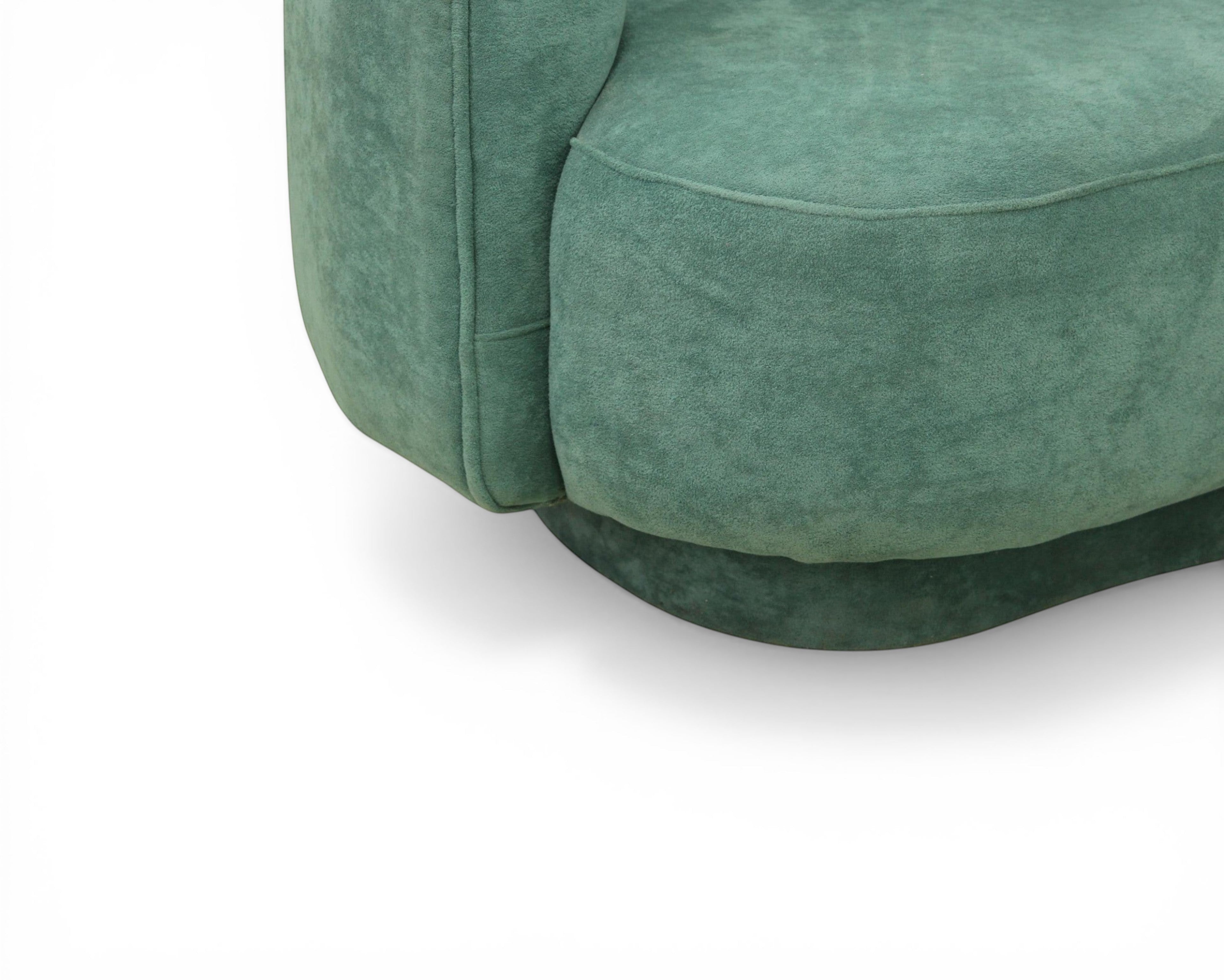 Nakoda Homes teal upholstered curved sofa set with plush fabric and rounded arms.