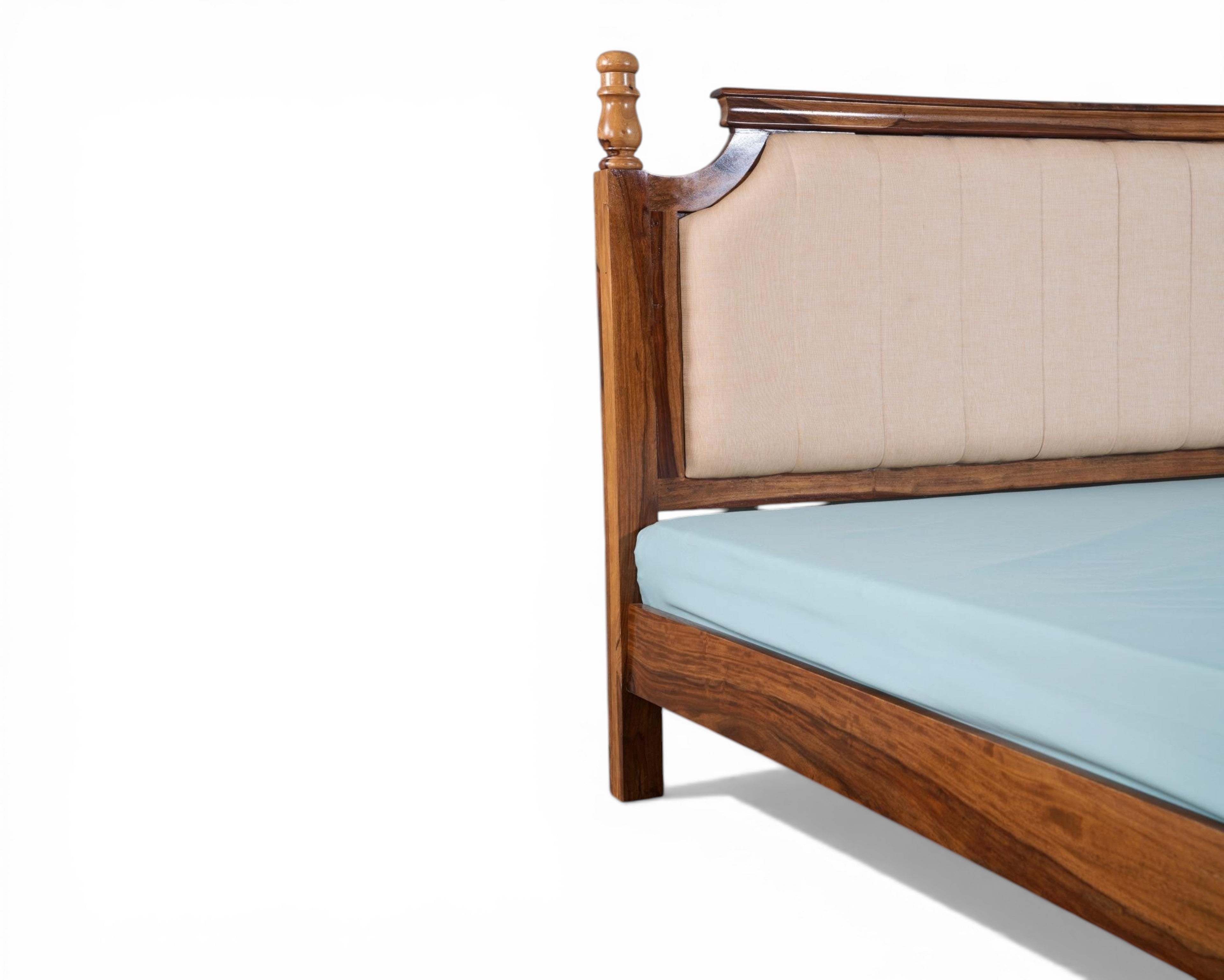 Nakoda Homes classic wooden bed frame with beige upholstered headboard and decorative wood accents.