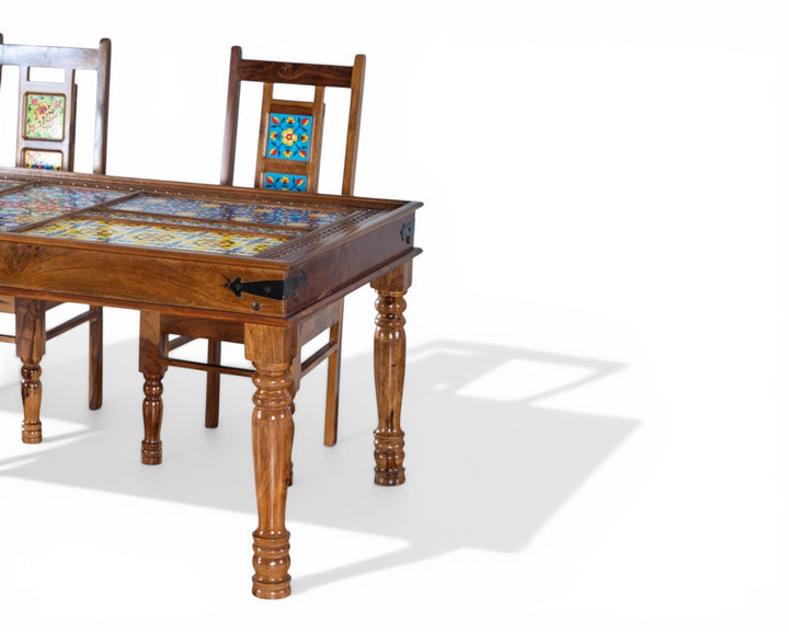 Nakoda Homes wooden dining set with colorful ceramic tile accents on chairs and table. Bohemian style.