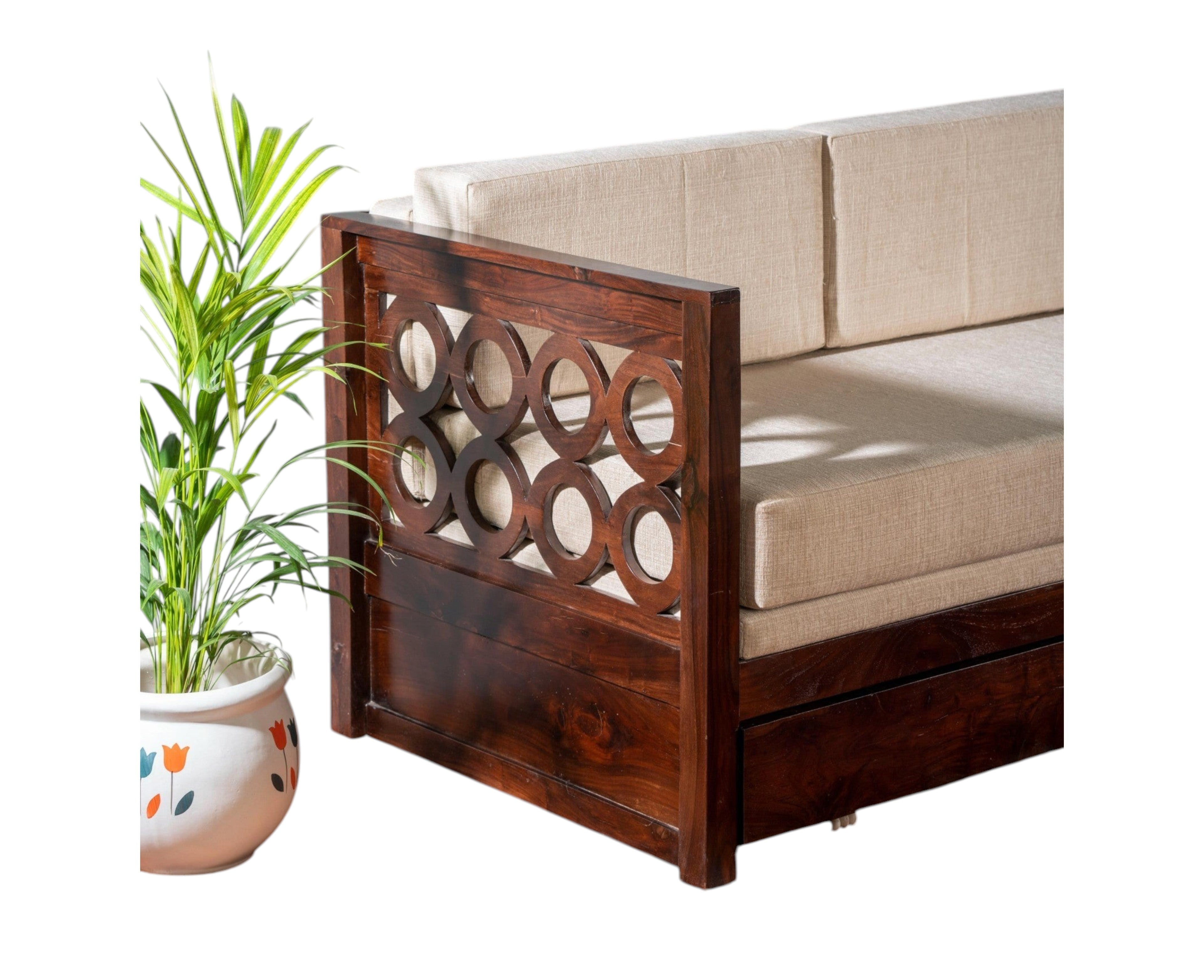 Nakoda Homes dark wood daybed with neutral upholstered seat and circular cut-out armrests.