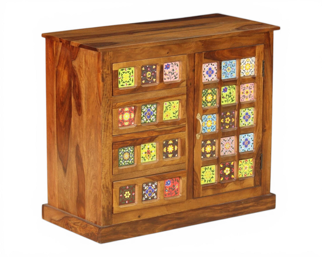 Nakoda Homes wooden cabinet with decorative hand-painted floral tiles on drawers and sliding door.