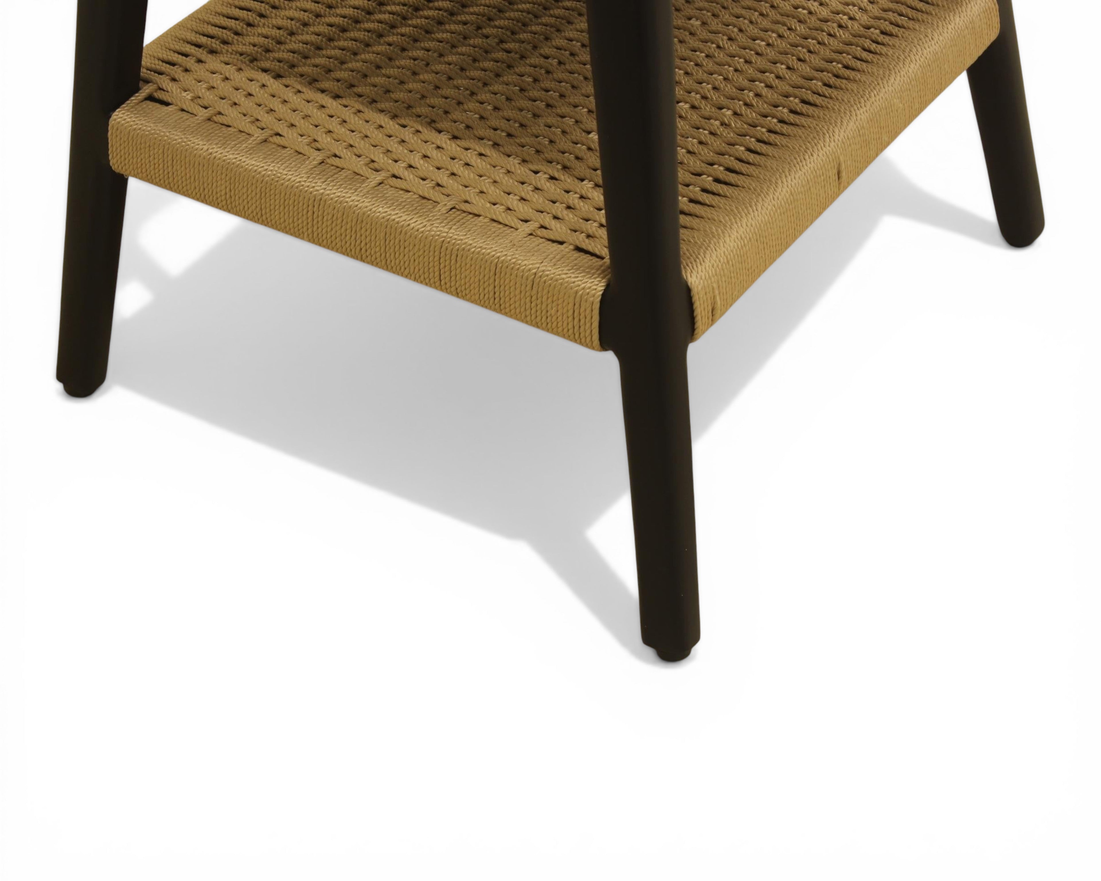 Nakoda Homes modern side table with black wooden frame and natural woven rattan shelf. Ideal for living rooms.