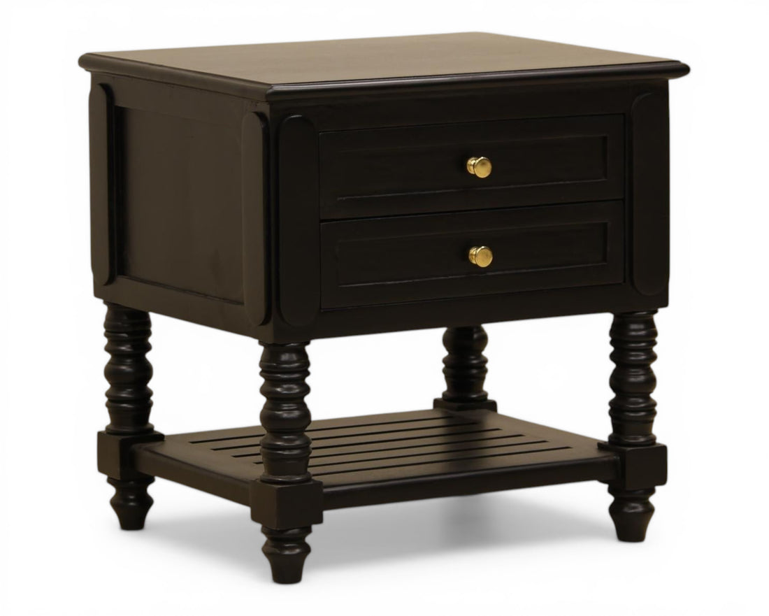 Nakoda Homes black wooden nightstand with two drawers, gold hardware, and slatted shelf. Classic bedside table with turned legs.