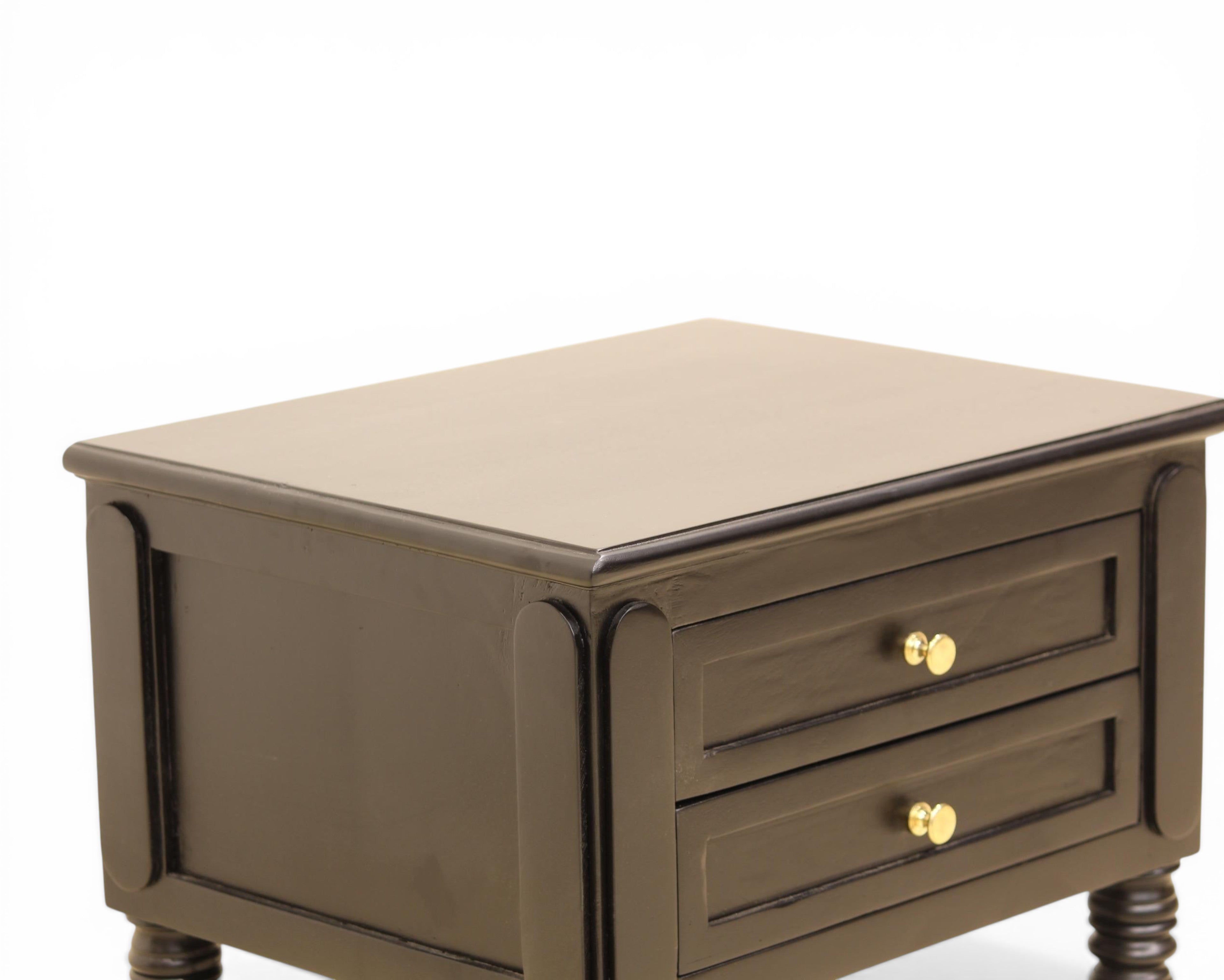Nakoda Homes black wooden nightstand with two drawers, gold hardware, and decorative legs. Offers classic bedroom storage.