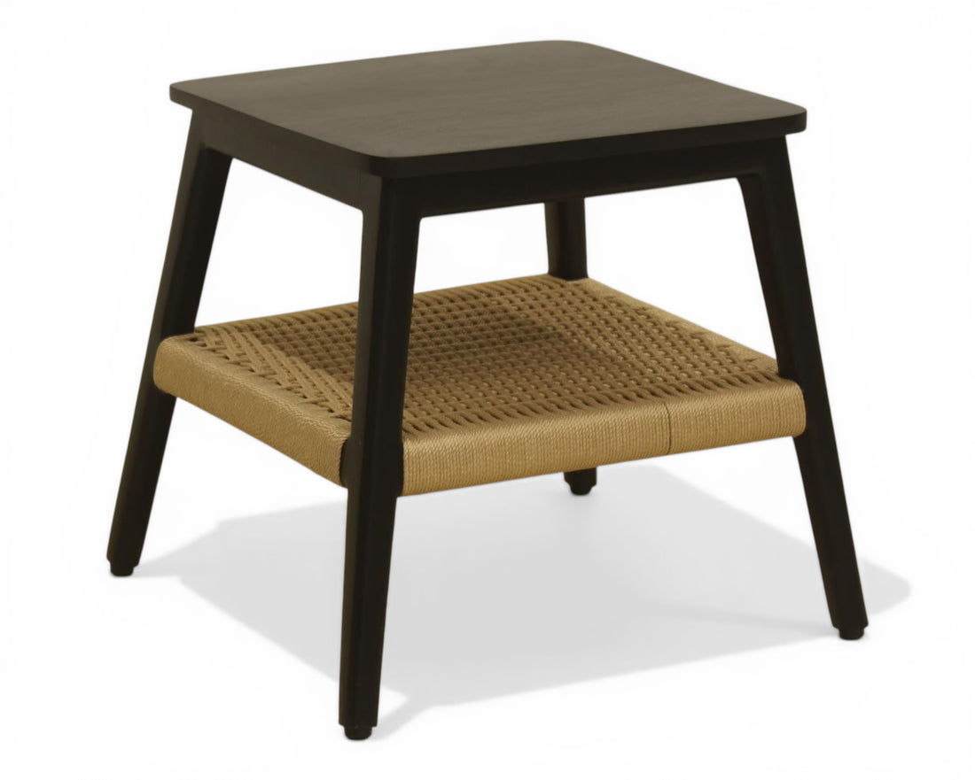 Nakoda Homes modern black wooden side table with natural woven rattan shelf. Ideal accent furniture.