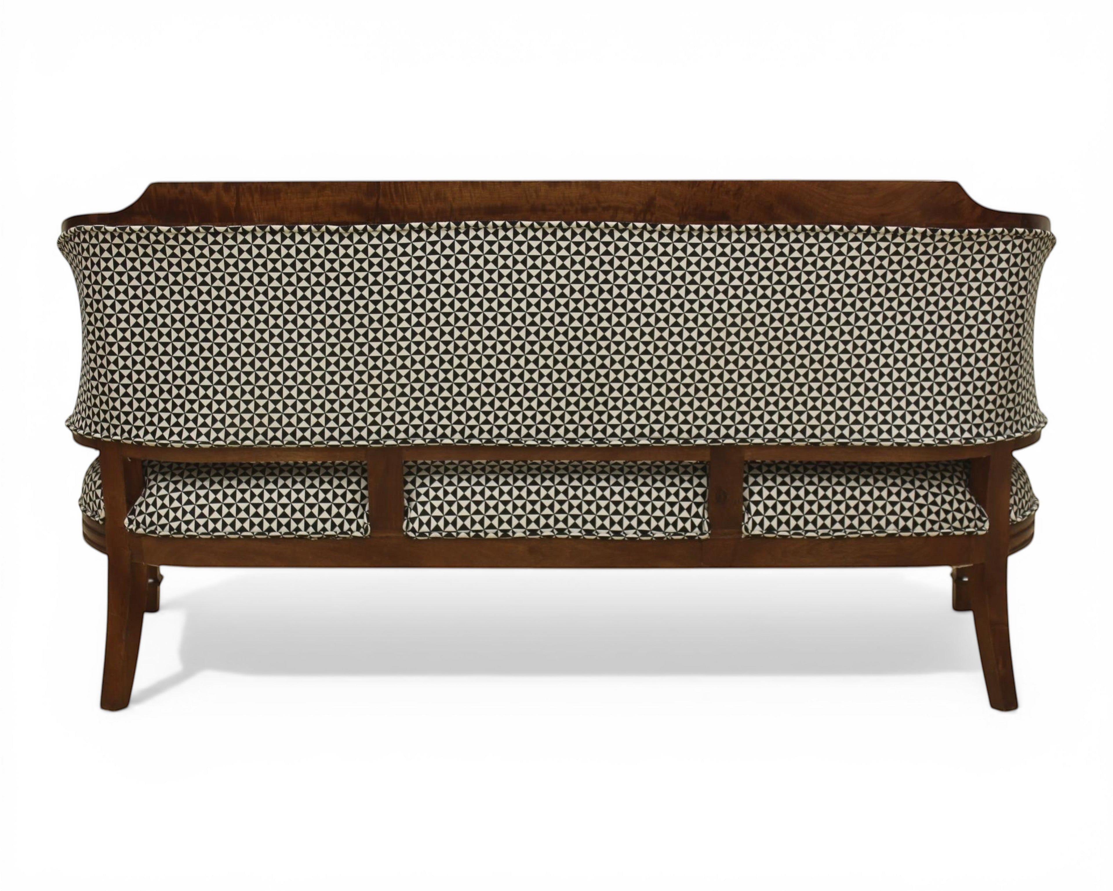 Nakoda Homes classic armchair and sofa set with wooden frame and black and white geometric patterned upholstery.