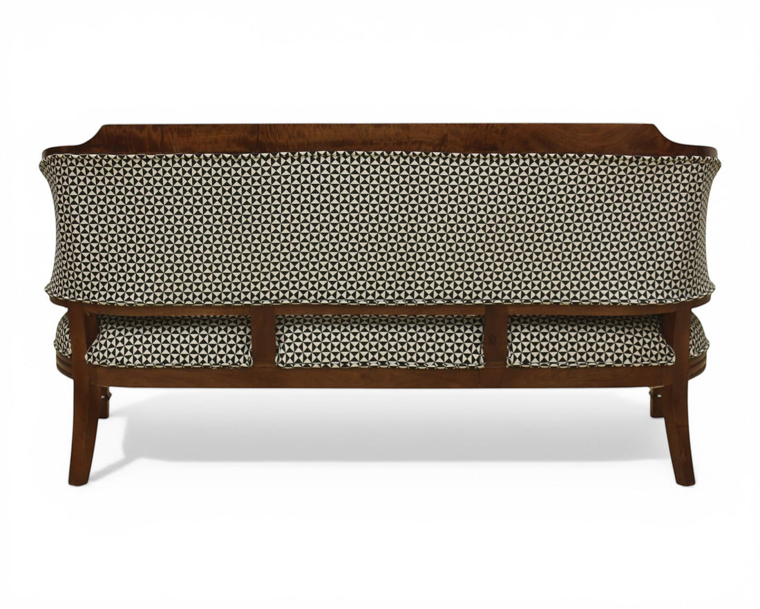 Nakoda Homes classic armchair and sofa set with wooden frame and black and white geometric patterned upholstery.