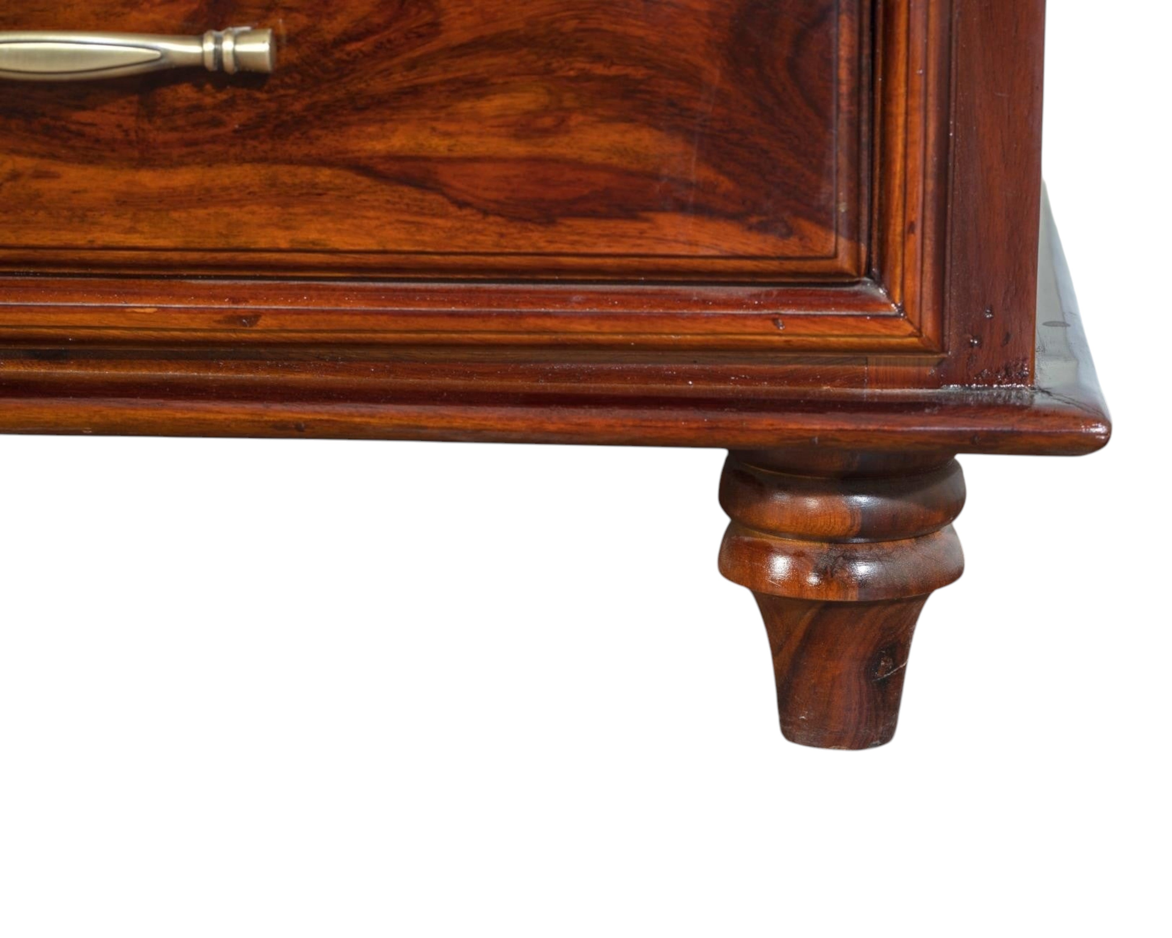 Nakoda Homes classic solid wood chest of drawers in warm brown with brass hardware and turned legs.