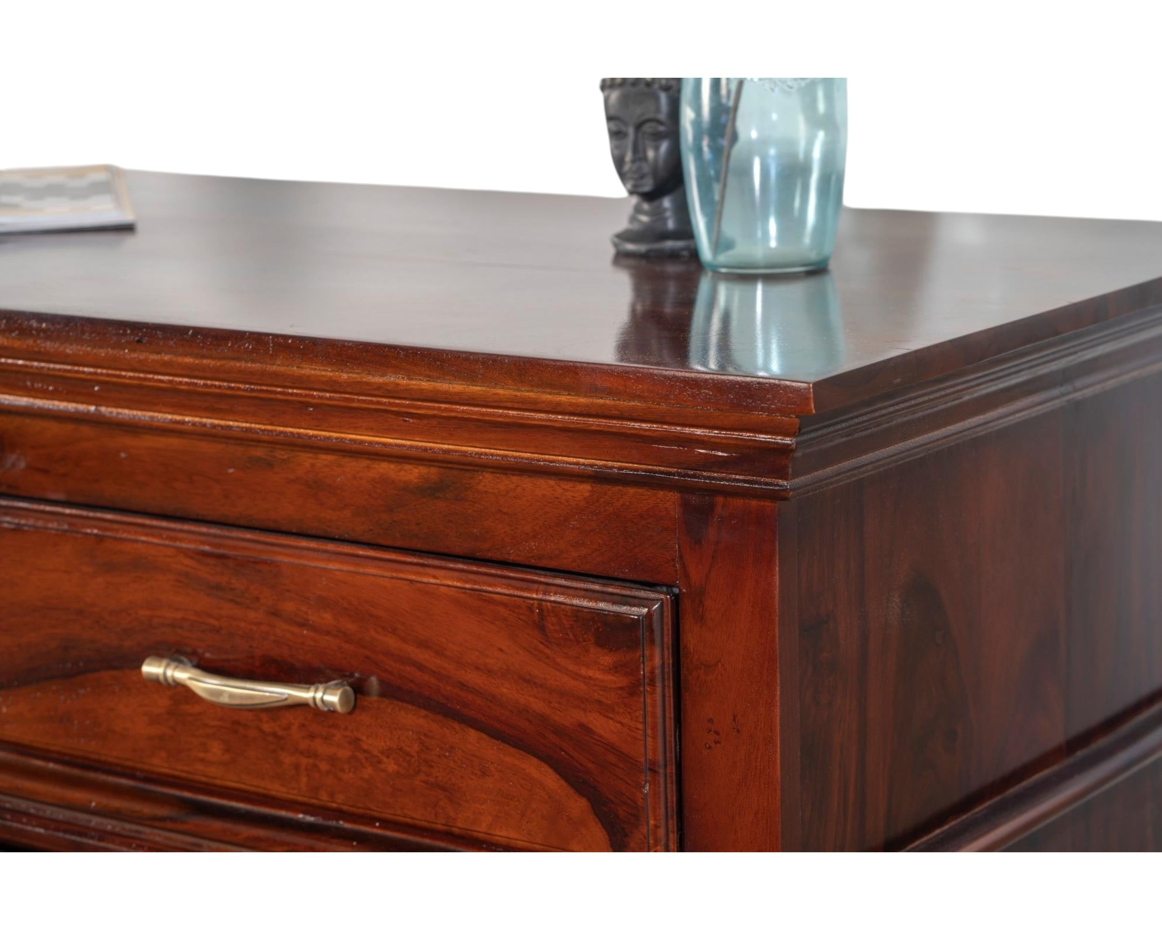 Nakoda Homes classic solid wood chest of drawers in warm brown with brass hardware and polished finish.
