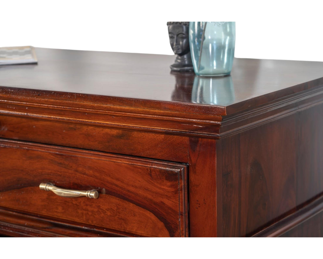 Nakoda Homes classic solid wood chest of drawers in warm brown with brass hardware and polished finish.