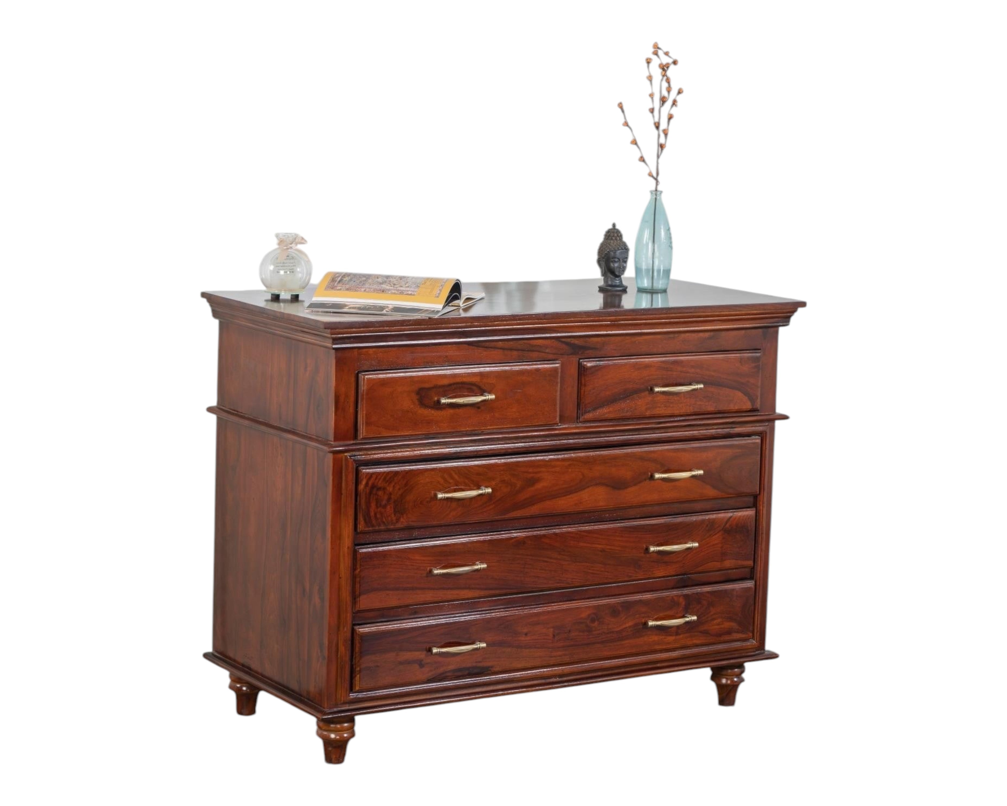 Nakoda Homes classic solid wood chest of drawers in warm brown with brass hardware and turned legs.