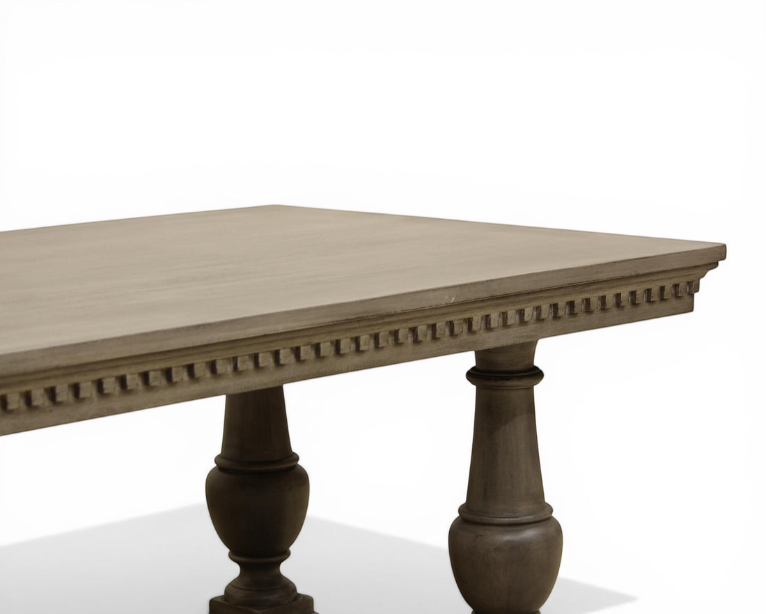 Nakoda Homes ornate grey wood dining table with carved edge and pedestal legs