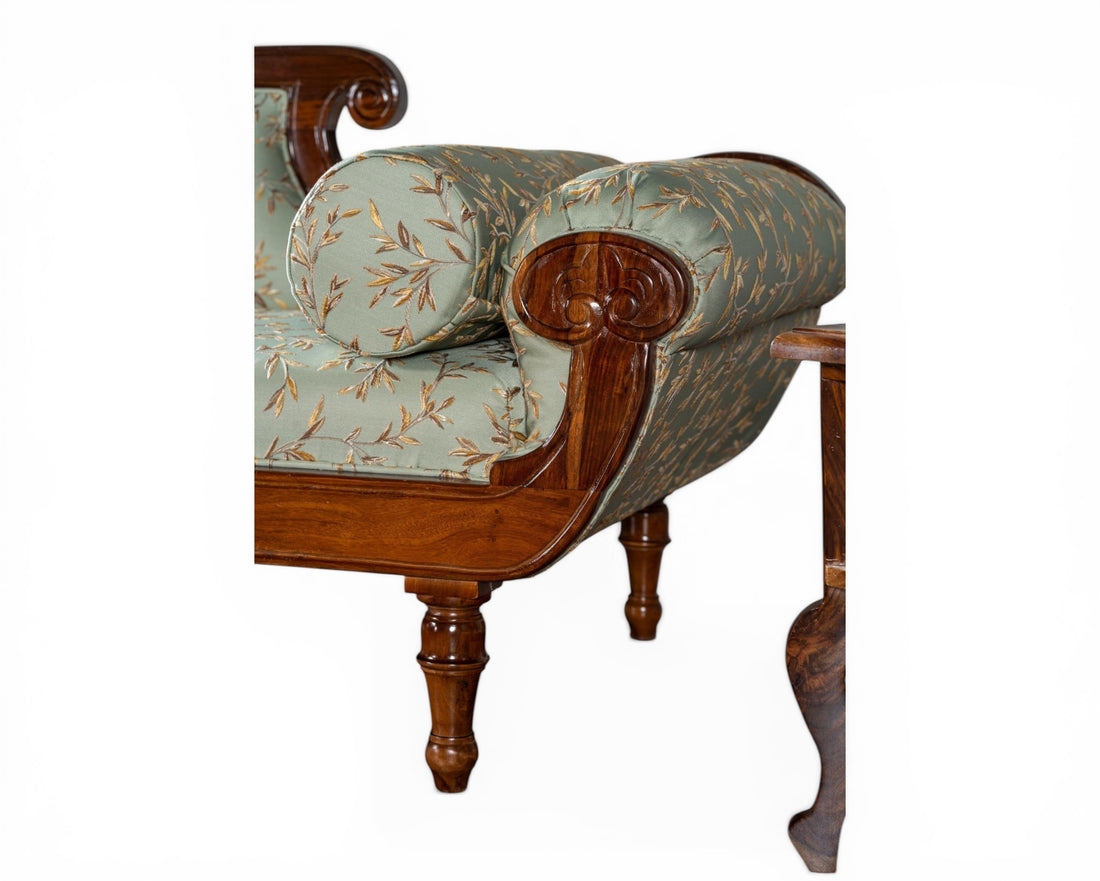 Nakoda Homes elegant chaise lounge sofa in light blue floral fabric with carved wooden frame and ornate detailing.