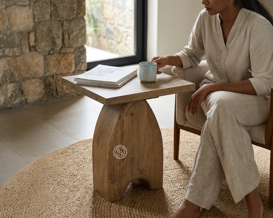 Nakoda Homes Loom side table made of weathered mango wood with a unique sculptural base and square top.